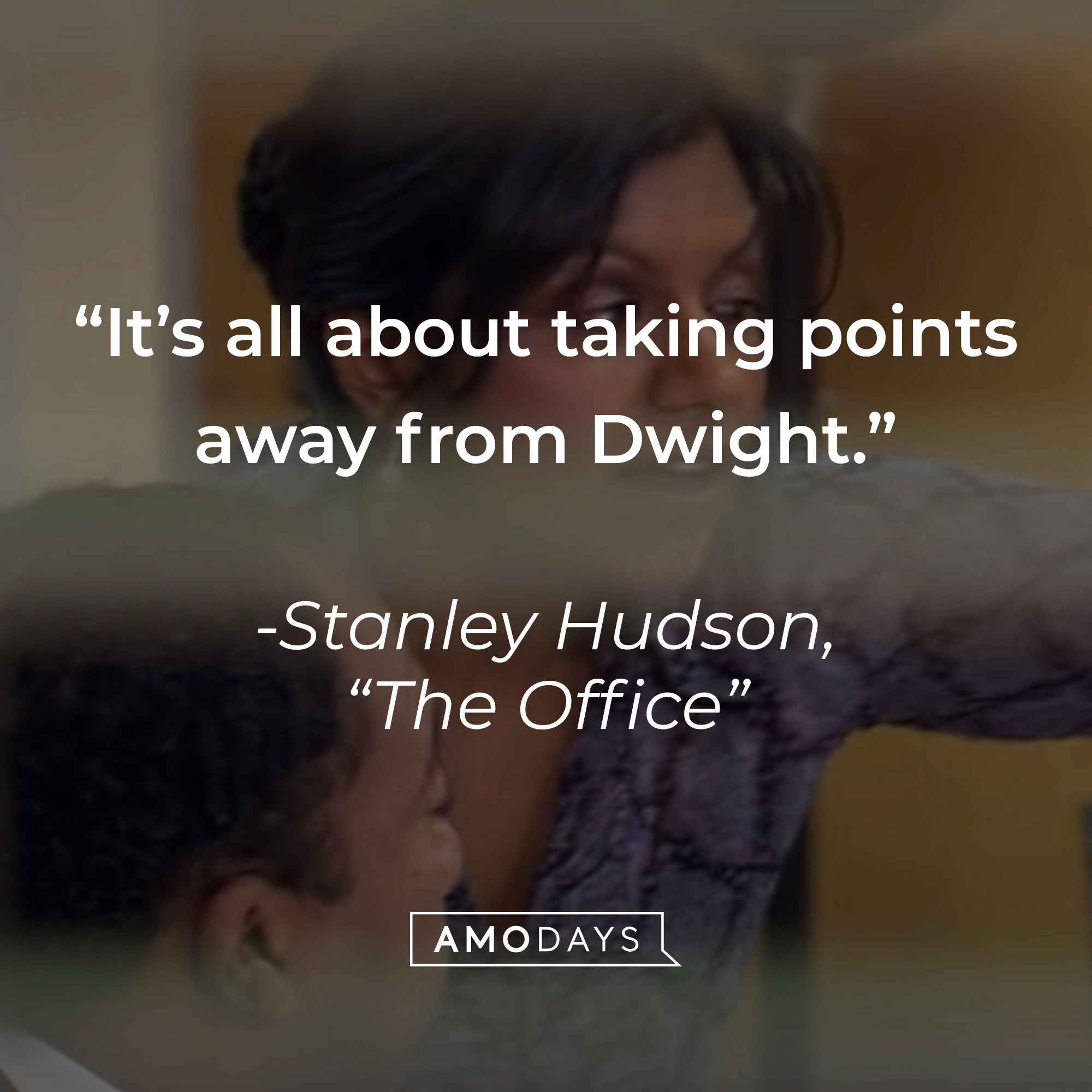An image of Leslie David Baker as Stanley Hudson in "The Office" with the quote: "It’s all about taking points away from Dwight." | Source: youtube.com/The Office