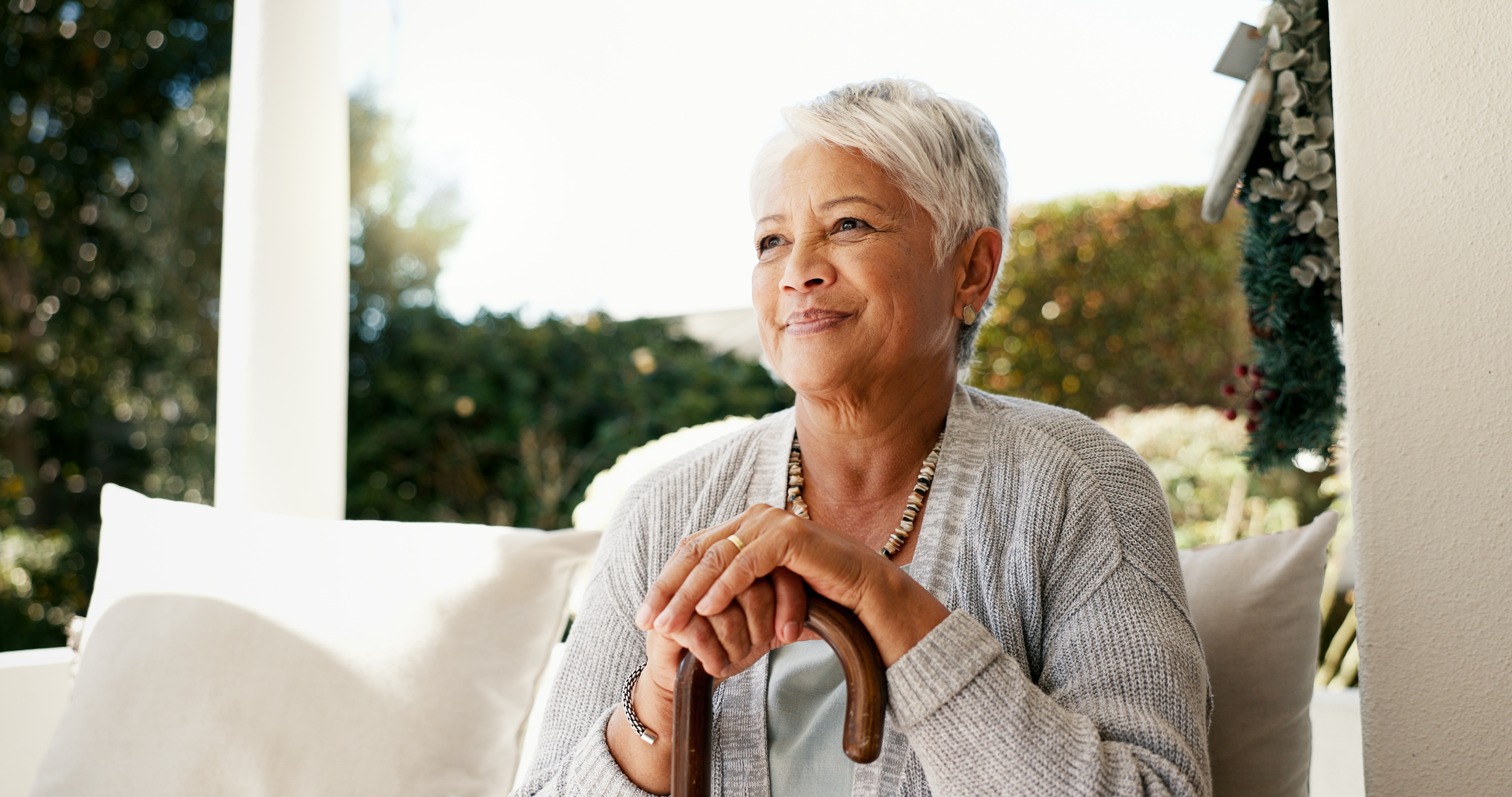 Woman enjoying a quiet moment on the porch | Source: Shutterstock