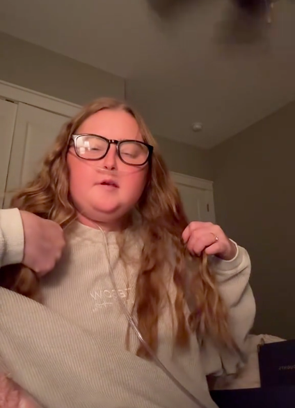 Anna Grace Phelan showing her followers the gifts she received from Tim Tebow, posted on May 16, 2025. | Source: TikTok/@phelann.annaa