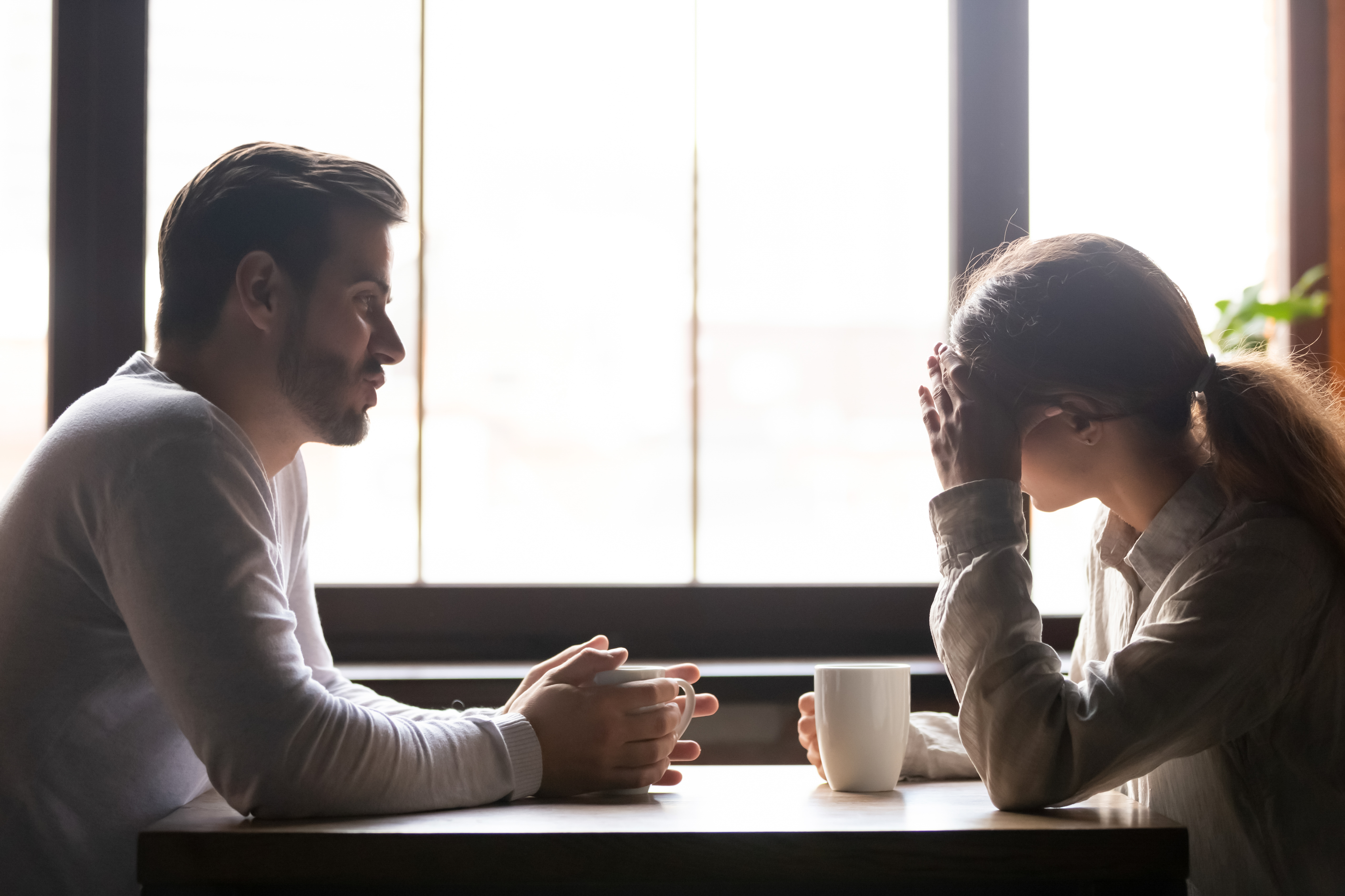 Upset woman and man talking | Source: Shutterstock