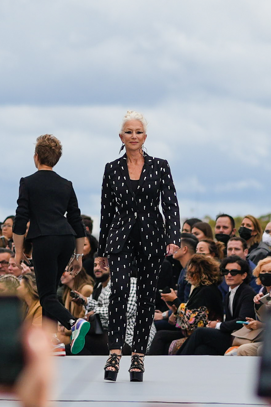 Mirren walks the runway during the L'Oréal show at Paris Fashion Week on 3 October 2021. Catwalks beware, she stormed the stage in a sharp patterned suit and sky-high heels, proving that age has nothing on attitude when it comes to owning the moment.