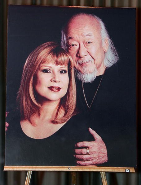 A photo of Pat Morita and his wife Evelyn is displayed during a memorial service for him at the Palm Mortuary & Memorial Park November 30, 2005 in Las Vegas, Nevada | Photo: Getty Images