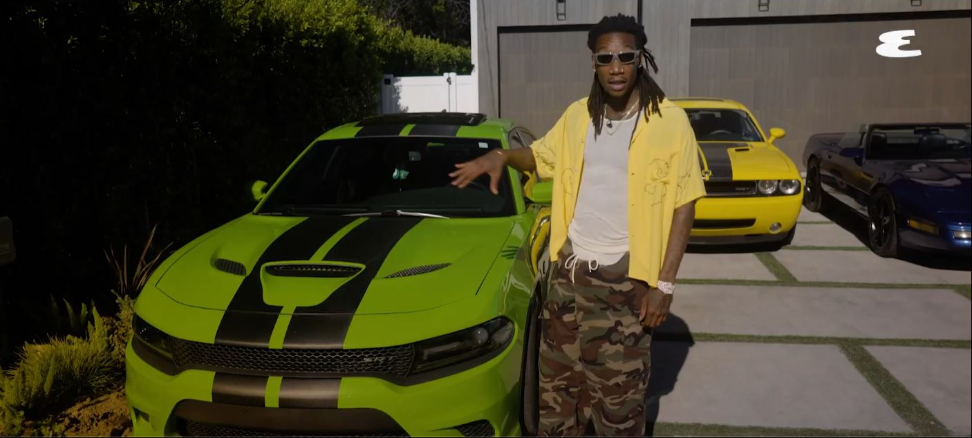 Wiz Khalifa stands beside his customized Dodge Challenger SRT Hellcat, which Dodge built for him in place of a performance fee after a promotional event. | Source: YouTube/Esquire