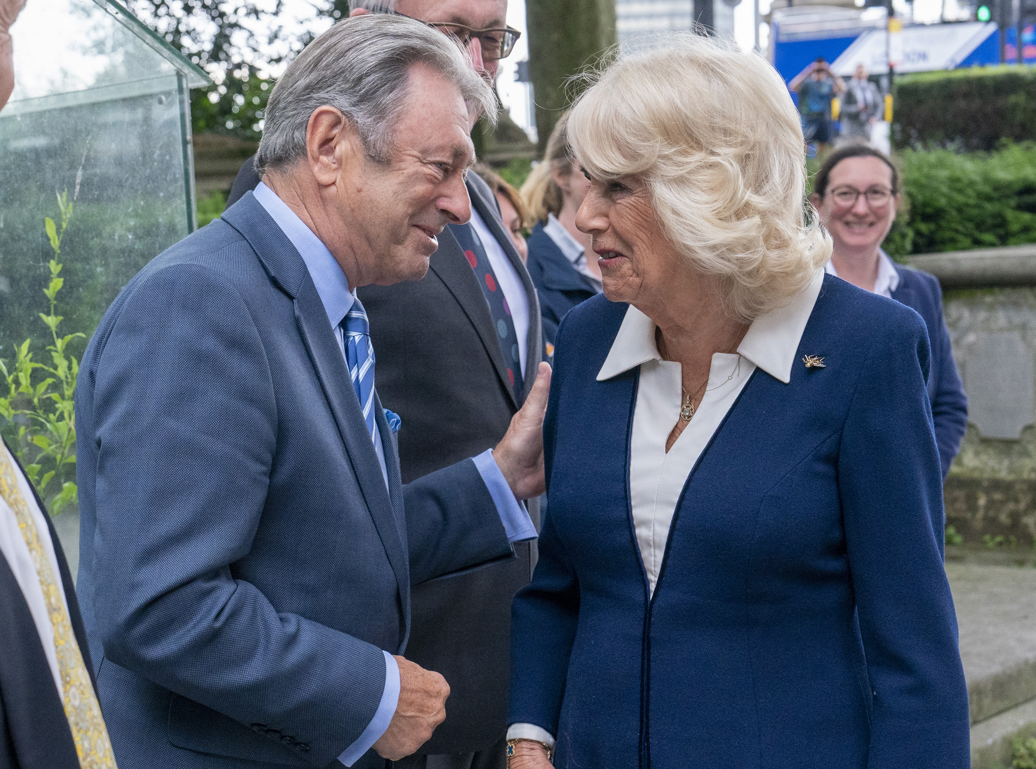 Alan Titchmarsh speaks to Queen Camilla at the Gardening Bohemia exhibition at The Garden Museum in London, England on June 12, 2024. | Source: Getty Images