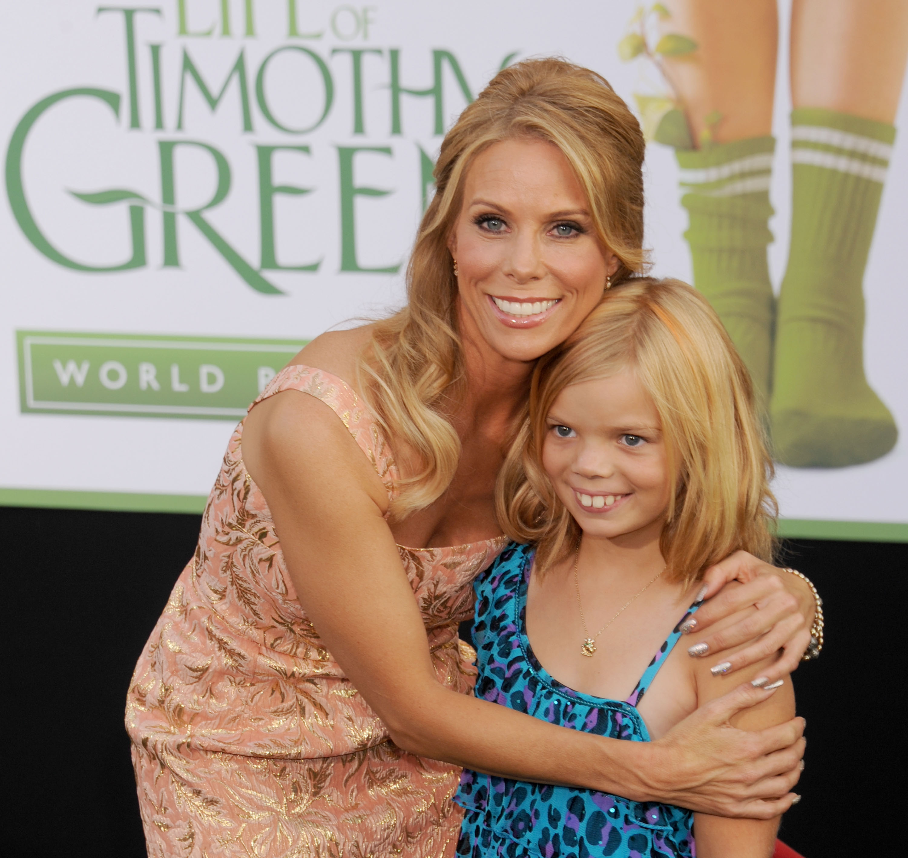 Actress Cheryl Hines and daughter Catherine Young Rose arrive at the Los Angeles premiere of "The Odd Life Of Timothy Green" at the El Capitan Theatre, on August 6, 2012, in Hollywood, California. | Source: Getty Images
