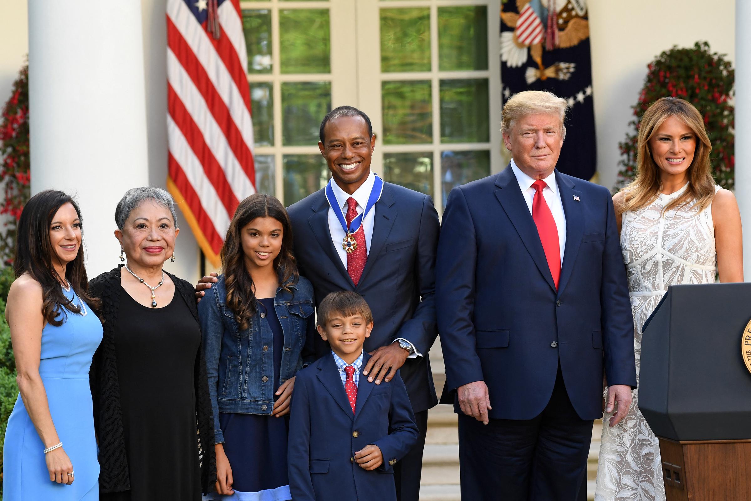 U.S. President Donald Trump and U.S. First Lady Melania Trump with Kultida, Tiger, Charlie, and Sam Woods, and Erica Herman at a Presidential Medal of Freedom ceremony in Washington, D.C., on May 6, 2019. | Source: Getty Images