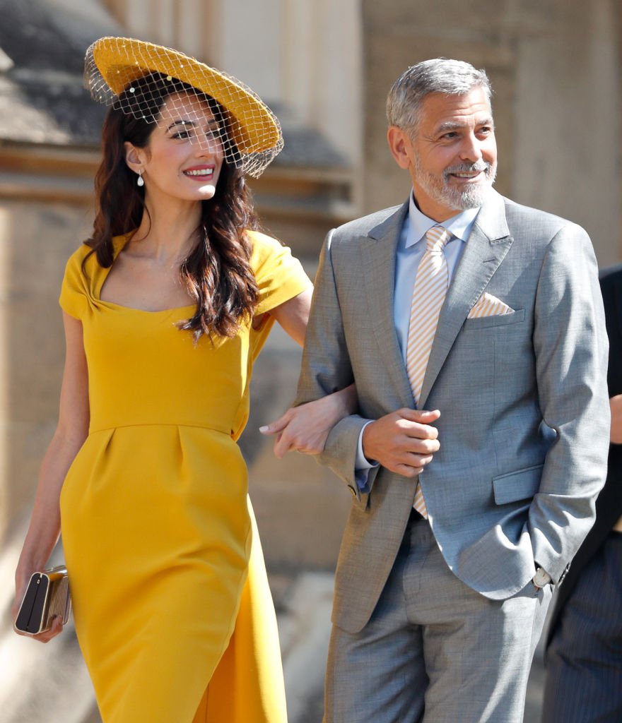 Amal Clooney and George Clooney on May 19, 2018 in Windsor, England | Photo: Getty Images