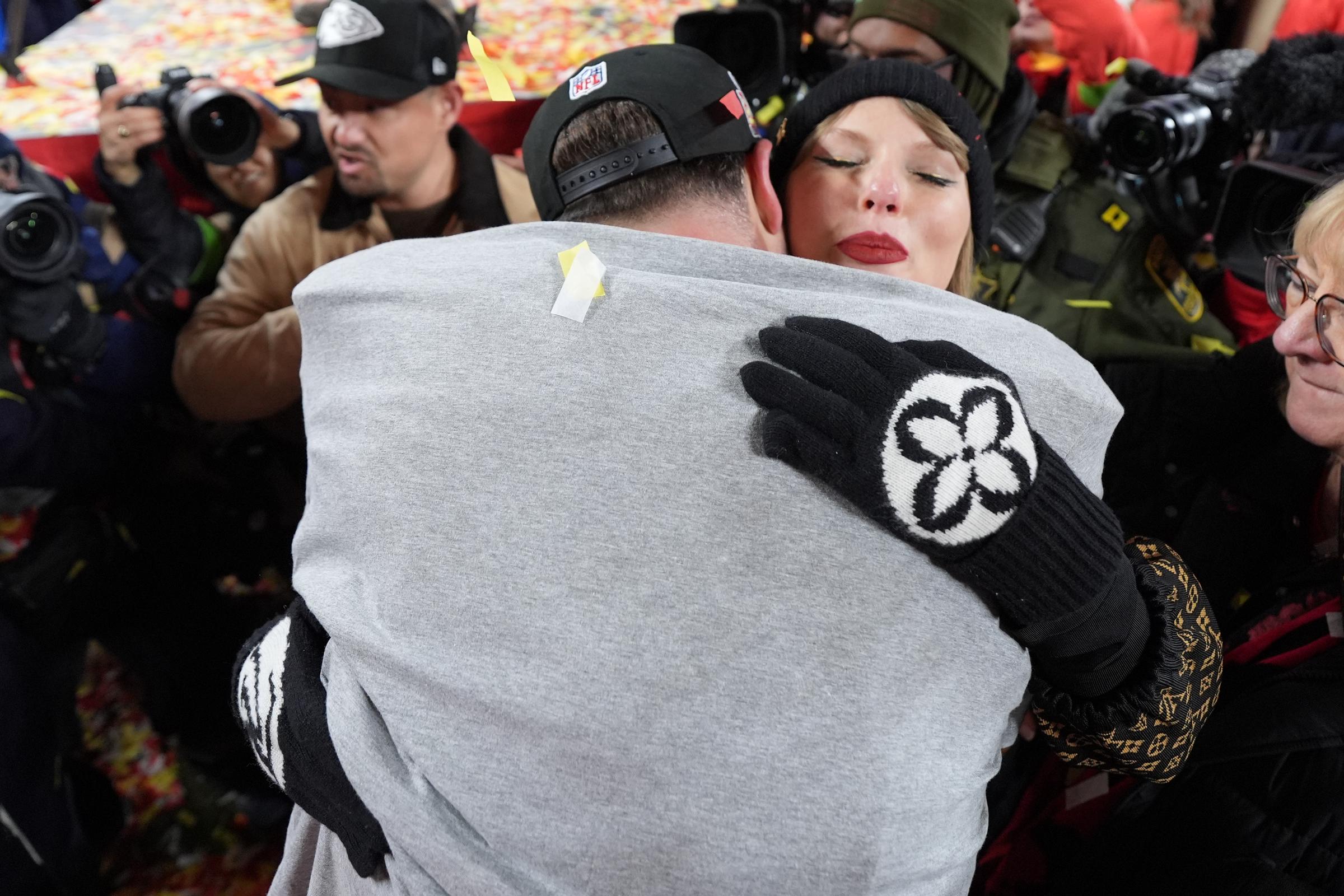 Travis Kelce #87 of the Kansas City Chiefs and Taylor Swift share a hug at GEHA Field at Arrowhead Stadium on January 26, 2025, in Kansas City, Missouri | Source: Getty Images