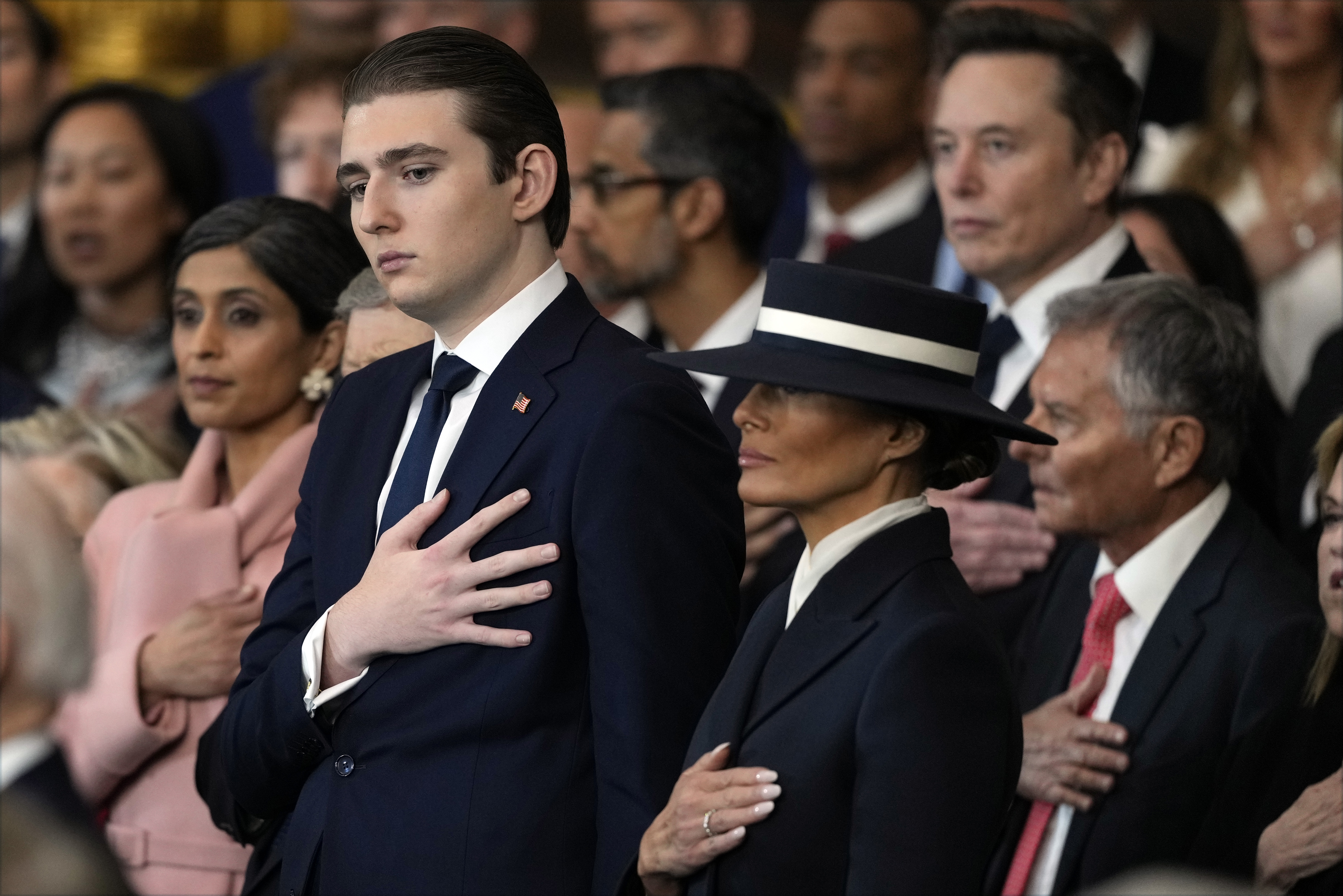 Barron and Melania Trump listen to Christopher Macchio sing at the inauguration of Donald Trump in the US Capitol Rotunda on January 20, 2025, in Washington, DC. | Source: Getty Images