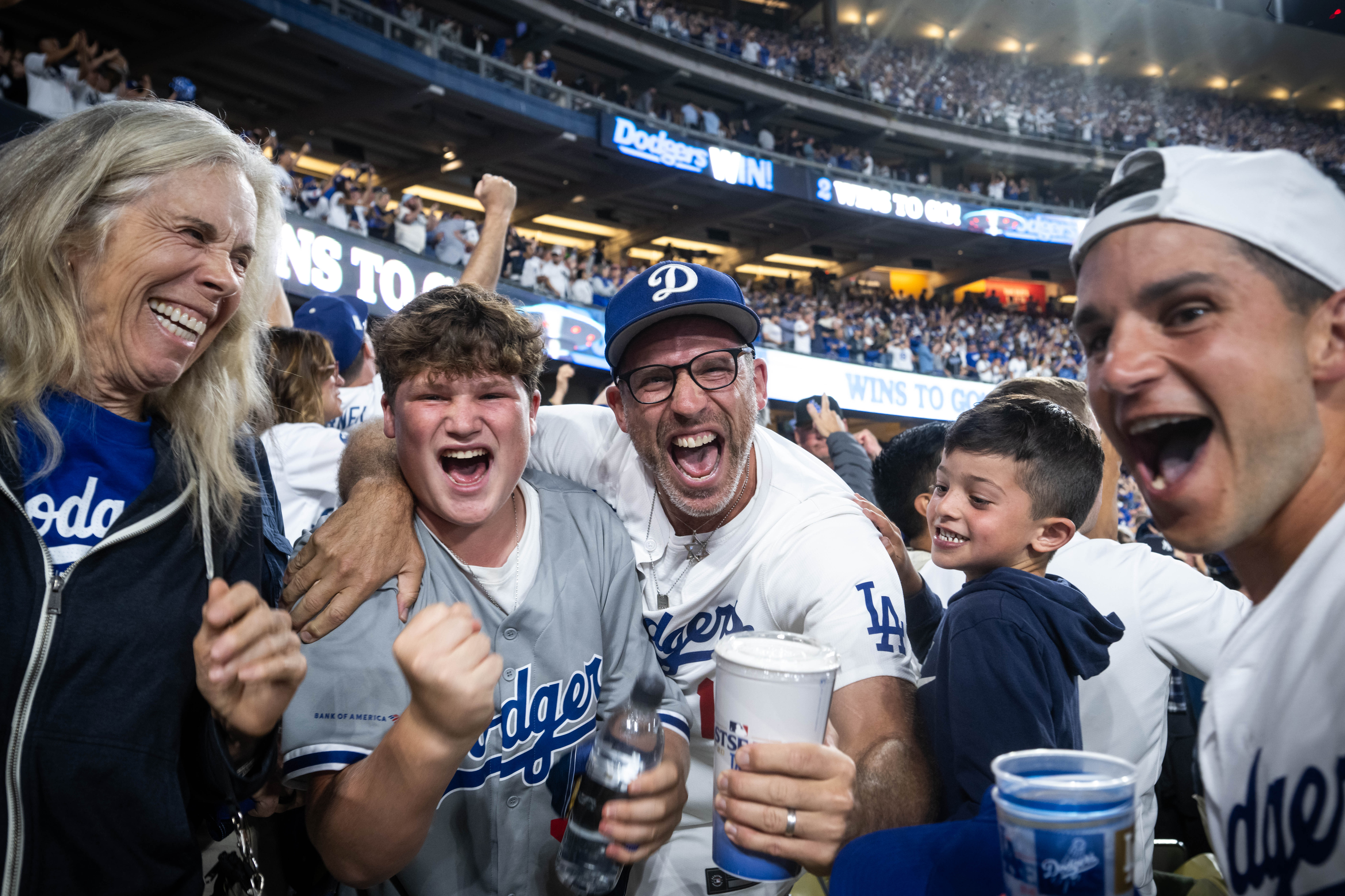 Dodger fans celebrate their team defeating the Yankees in Game 2 of the World Series at Dodger Stadium in Los Angeles on October 26, 2024 | Source: Getty Images