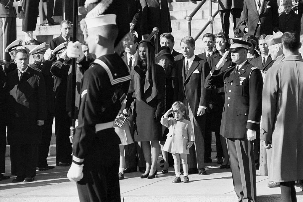 John F. Kennedy Jr. salutes as the casket of his father, the late President John F. Kennedy is carried from St. Matthew's Cathedral in Washington, DC. on November 25, 1963 | Photo: Getty Images