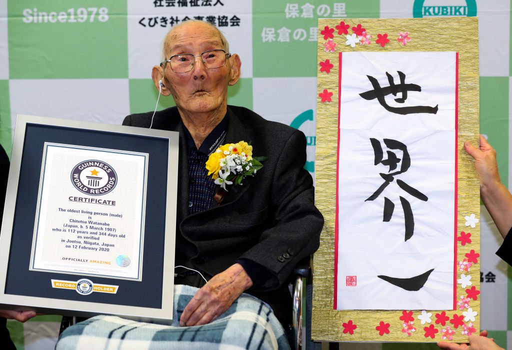 112-year-old Chitetsu Watanabe poses with the certificate and calligraphy as he is recognised as the World's Oldest Man by the Guinness World Record on February 12, 2020 in Joetsu, Niigata, Japan | Photo: Getty Images
