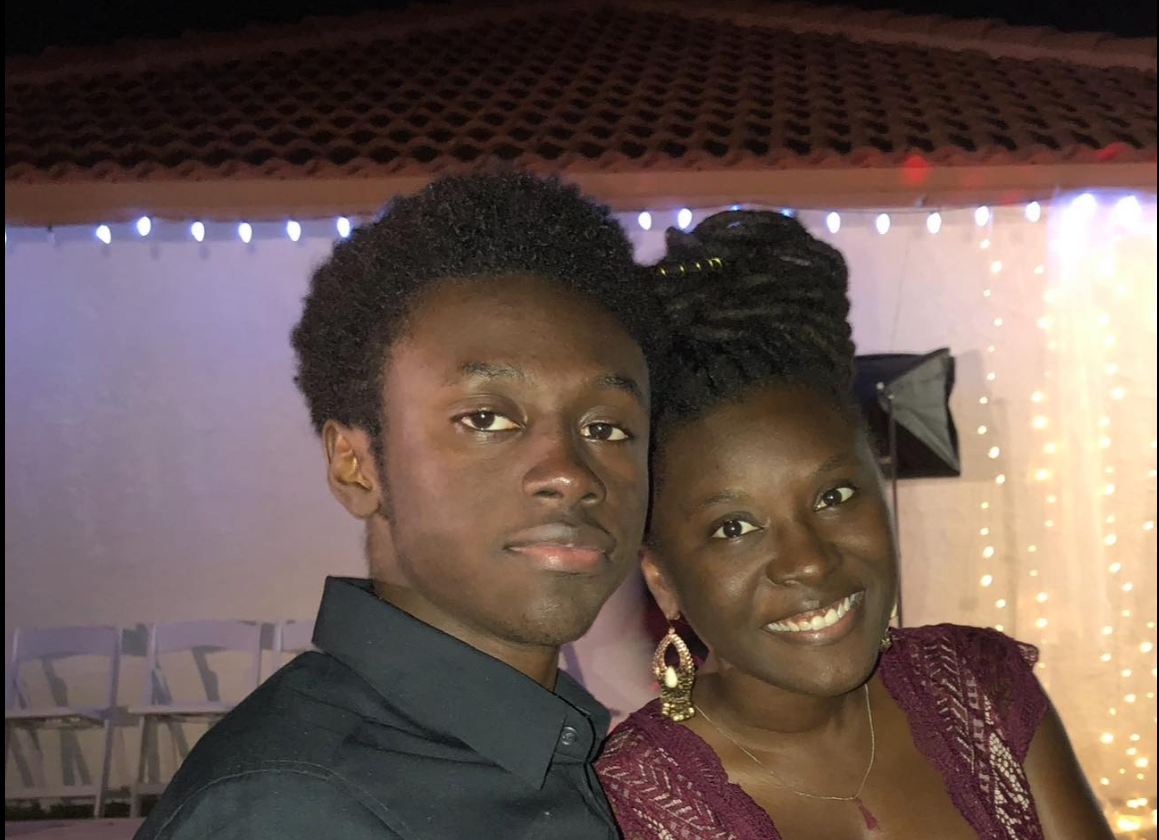 Smiling warmly beside her brother, Donovan Metayer, Nancy Metayer Bowen leans in close for a portrait, the pair framed by soft lights that give the moment an intimate, celebratory feel. | Source: Facebook/Nancy Metayer Bowen