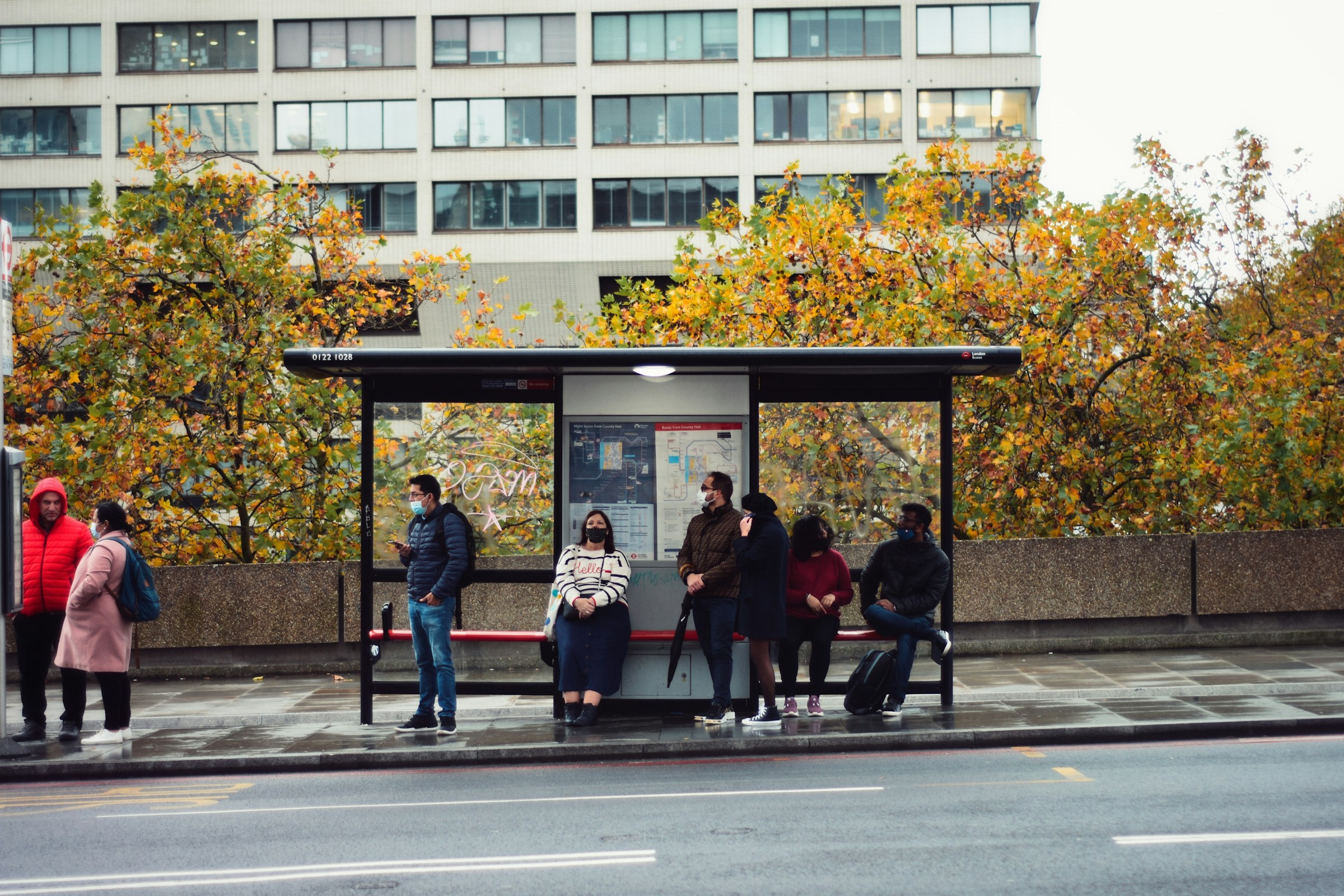 People waiting for bus at a bus stop | Source: Unsplash