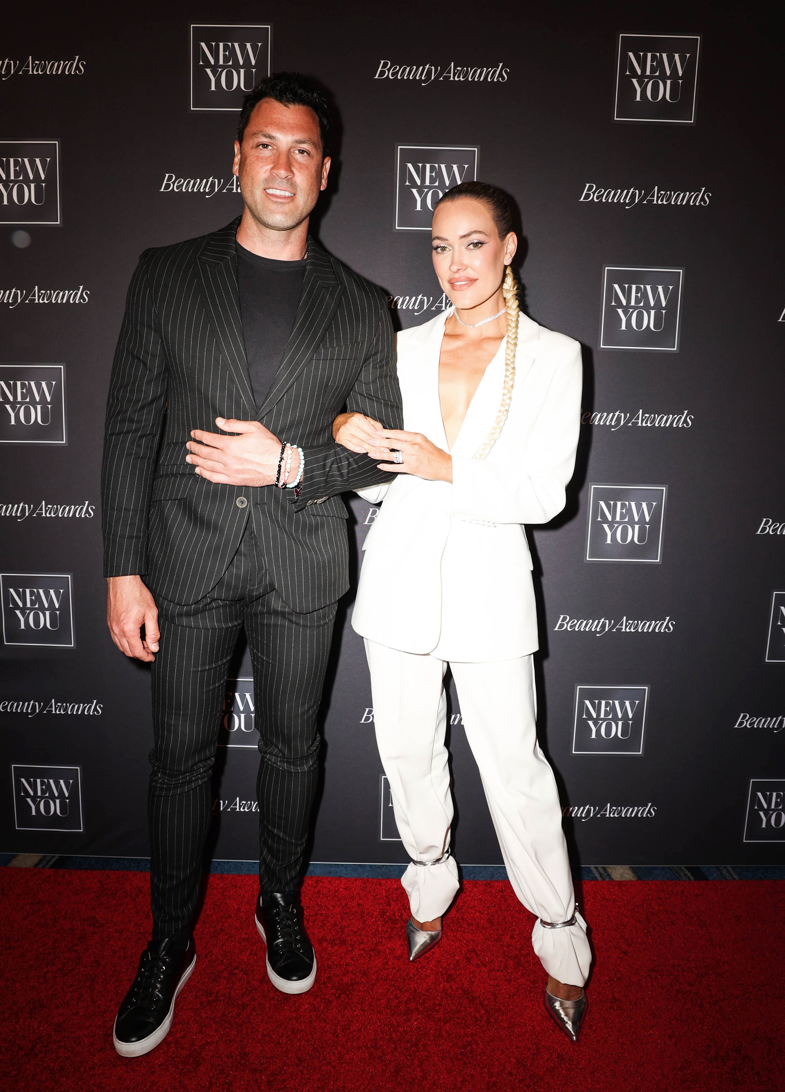 Maksim Chmerkovskiy and Peta Murgatroyd seen at 2022 New You Beauty Awards at Fontainebleau Miami Beach on April 07, 2022 in Miami Beach, Florida. | Source: Getty Images