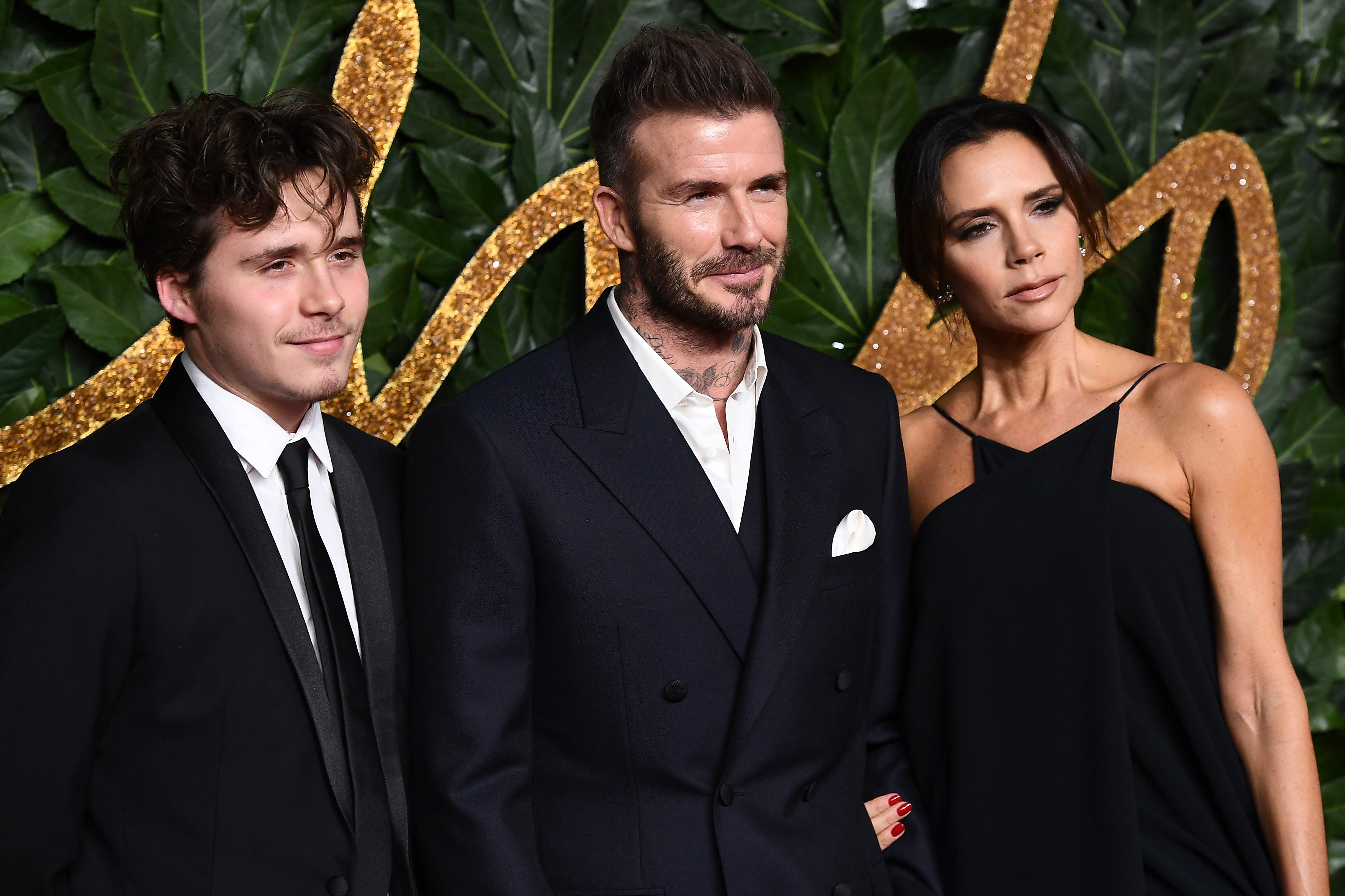 Brooklyn Beckham, David Beckham and Victoria Beckham arrive at The Fashion Awards 2018 In Partnership With Swarovski at Royal Albert Hall on December 10, 2018 in London, England. | Source: Getty Images