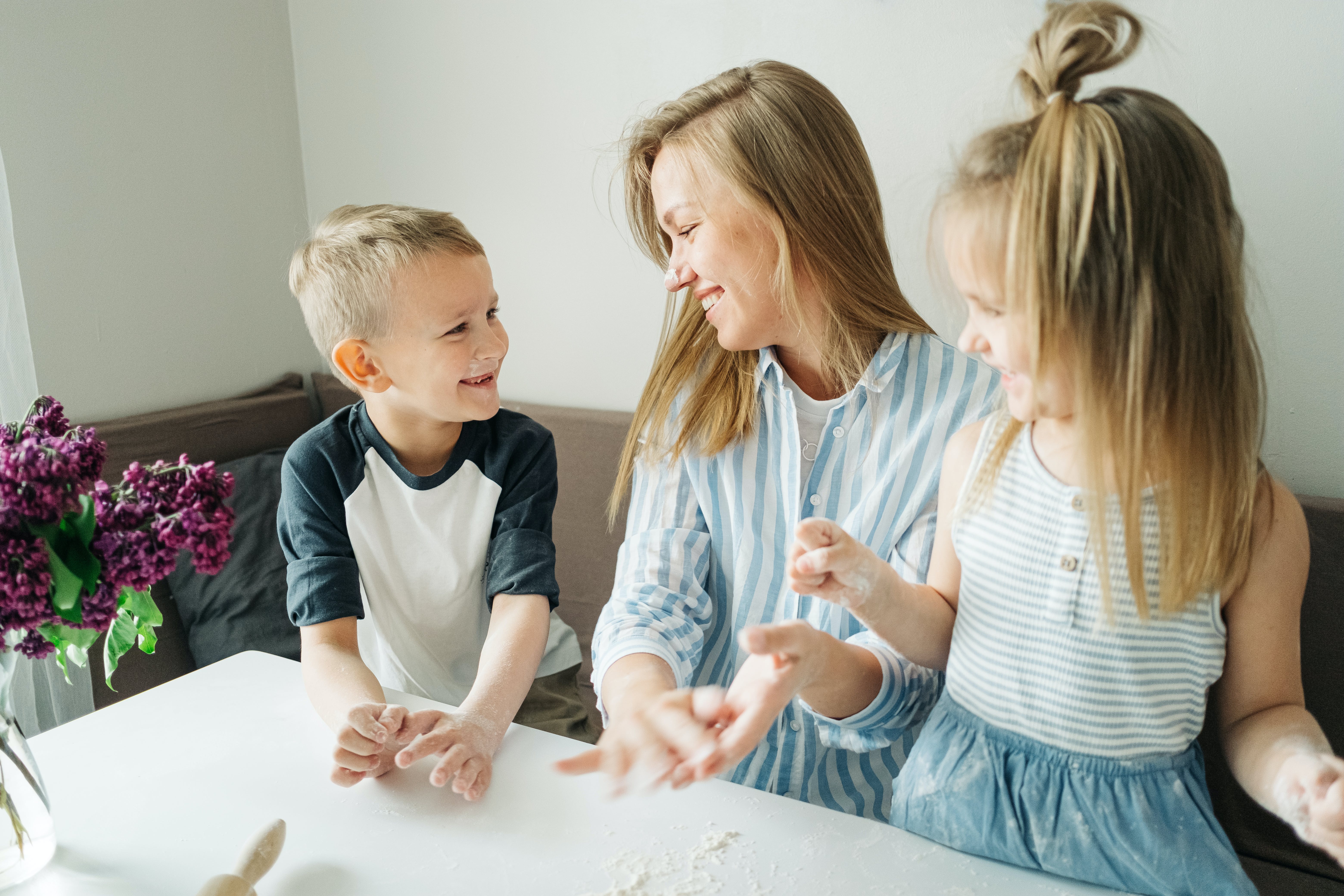 A woman bonding with other son and daughter | Source: Pexels