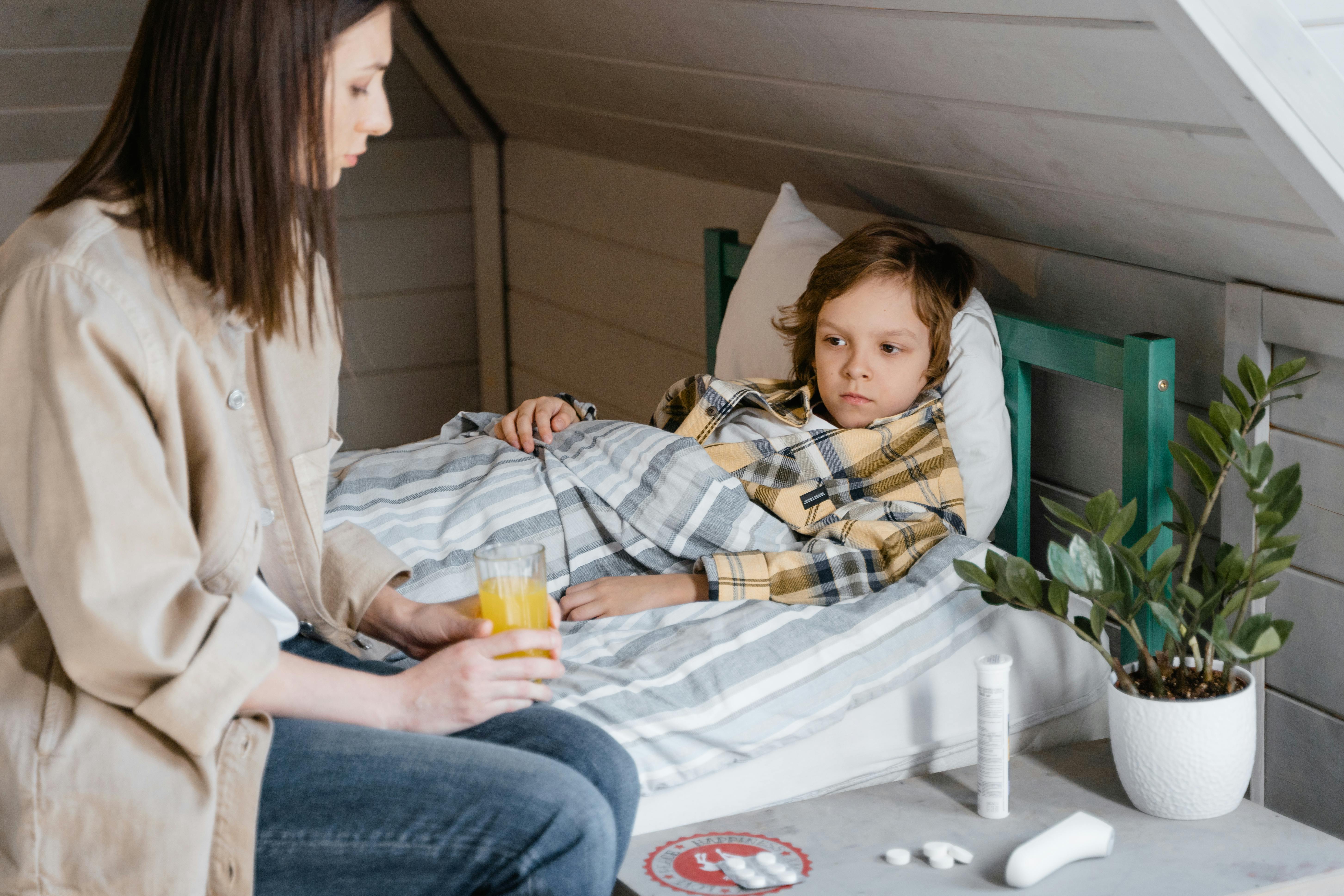 A mother looking after her sick child | Source: Pexels