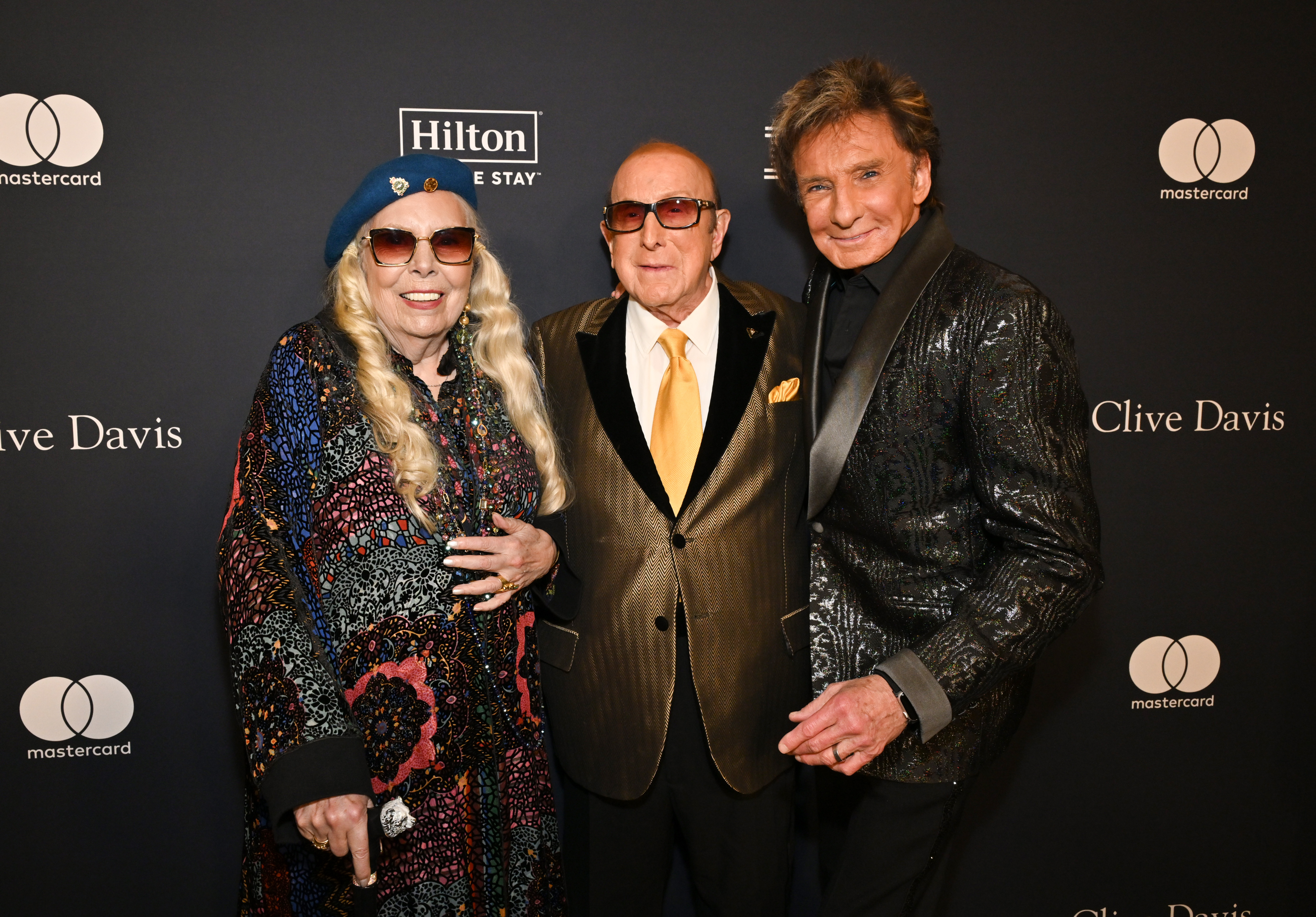 Joni Mitchell, Clive Davis, and Barry Manilow attend the 67th Annual GRAMMY Awards Pre-GRAMMY Gala & GRAMMY Salute to Industry Icons Honoring Jody Gerson on February 1, 2025, in Los Angeles, California | Source: Getty Images