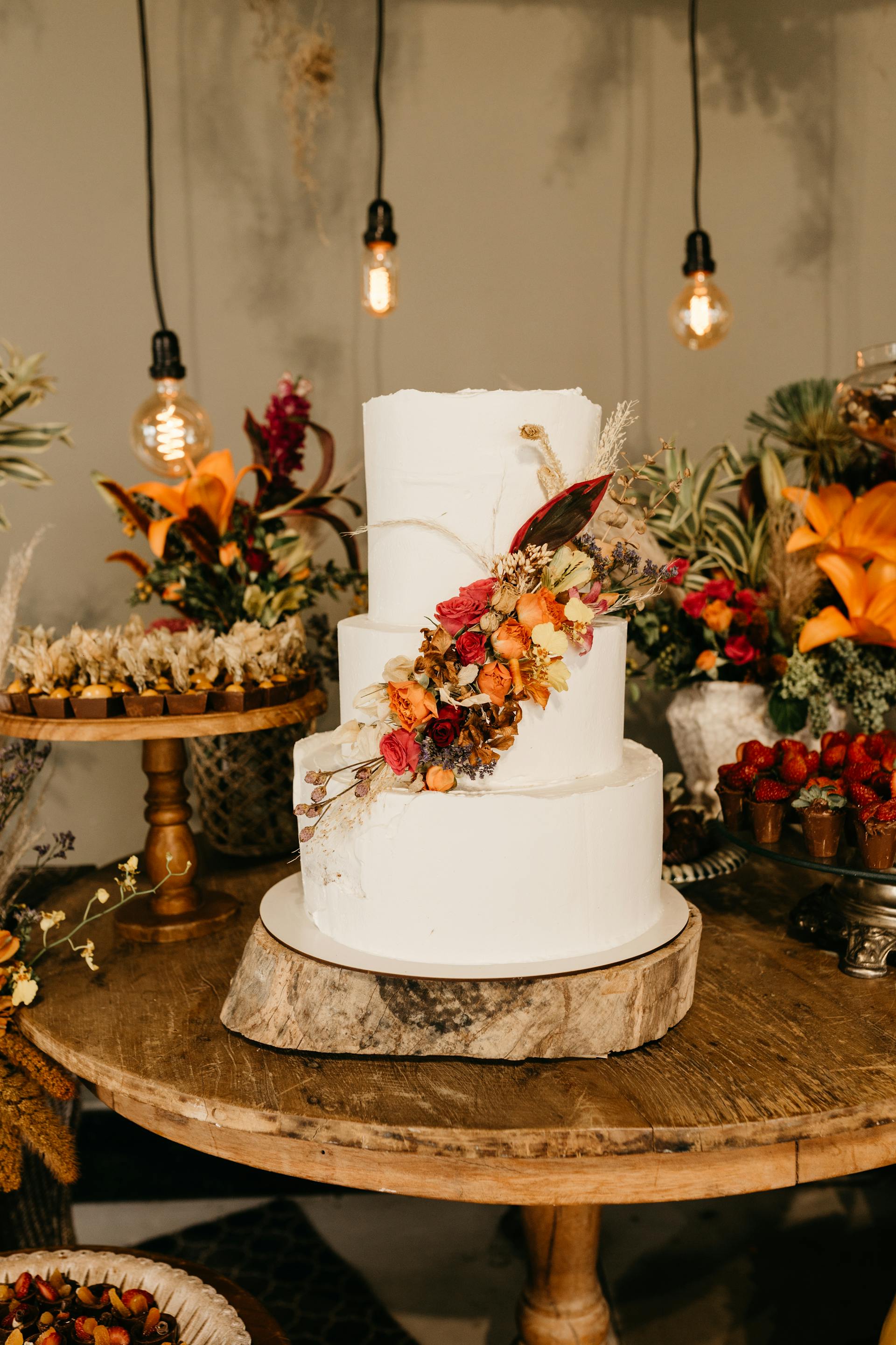 A wedding cake on a dessert table | Source: Pexels