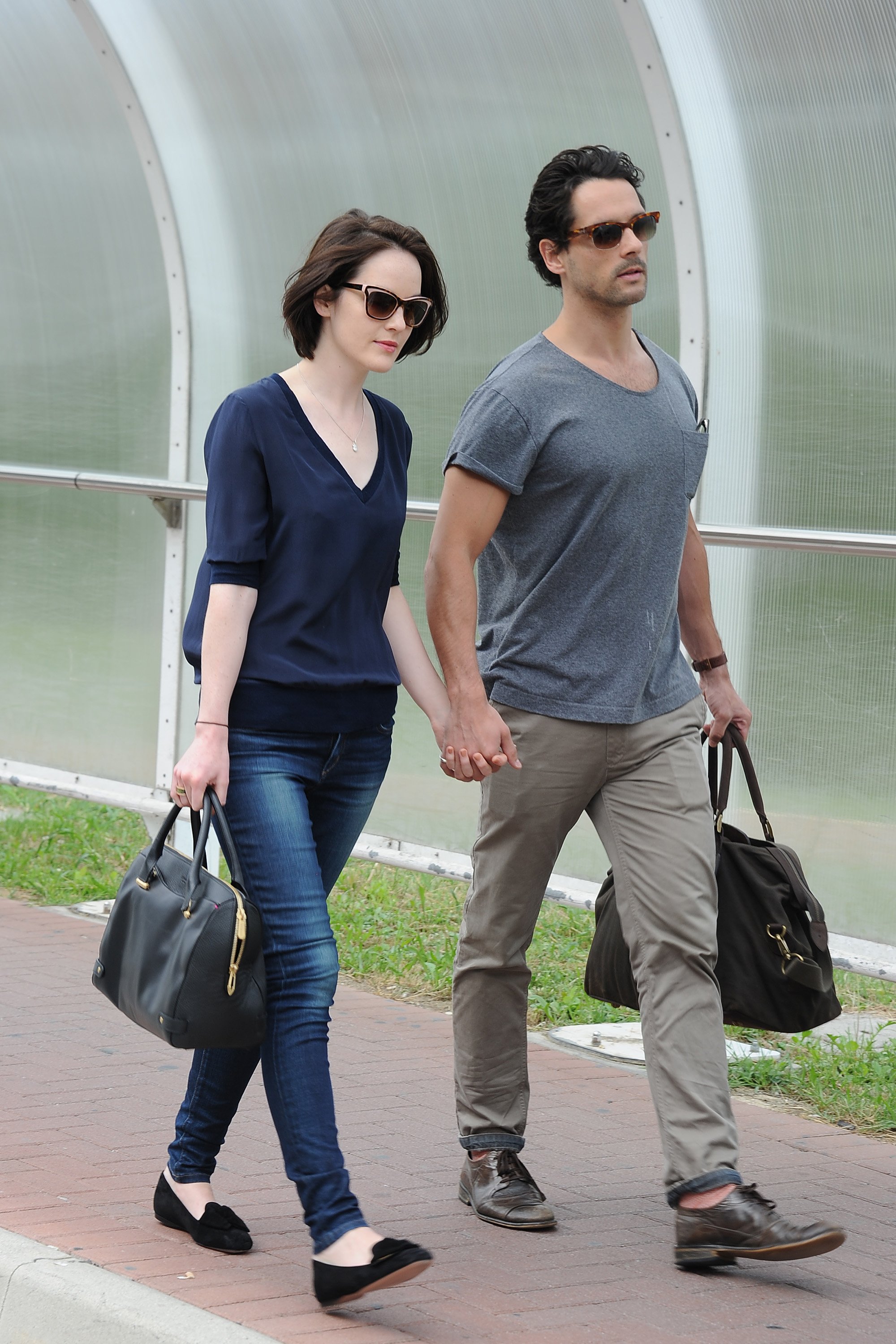 Michelle Dockery and John Dineen are seen leaving the Venice Airport during The 70th Venice International Film Festival on September 1, 2013 in Venice, Italy. | Source Gerry Images