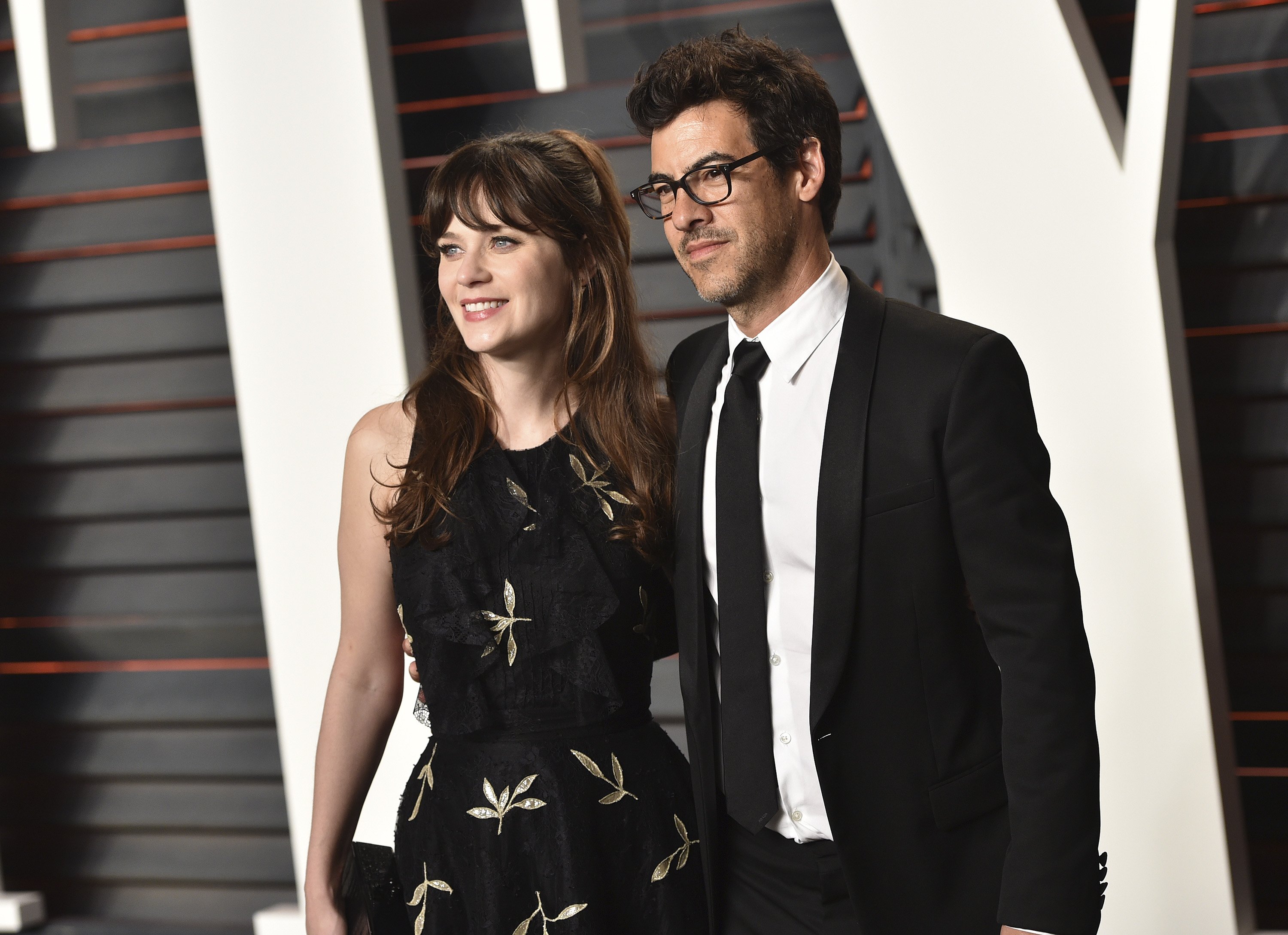 Zooey Deschanel and Jacob Pechenik arrive at the 2016 Vanity Fair Oscar Party Hosted By Graydon Carter on February 28, 2016, in Beverly Hills, California. | Source: Getty Images.