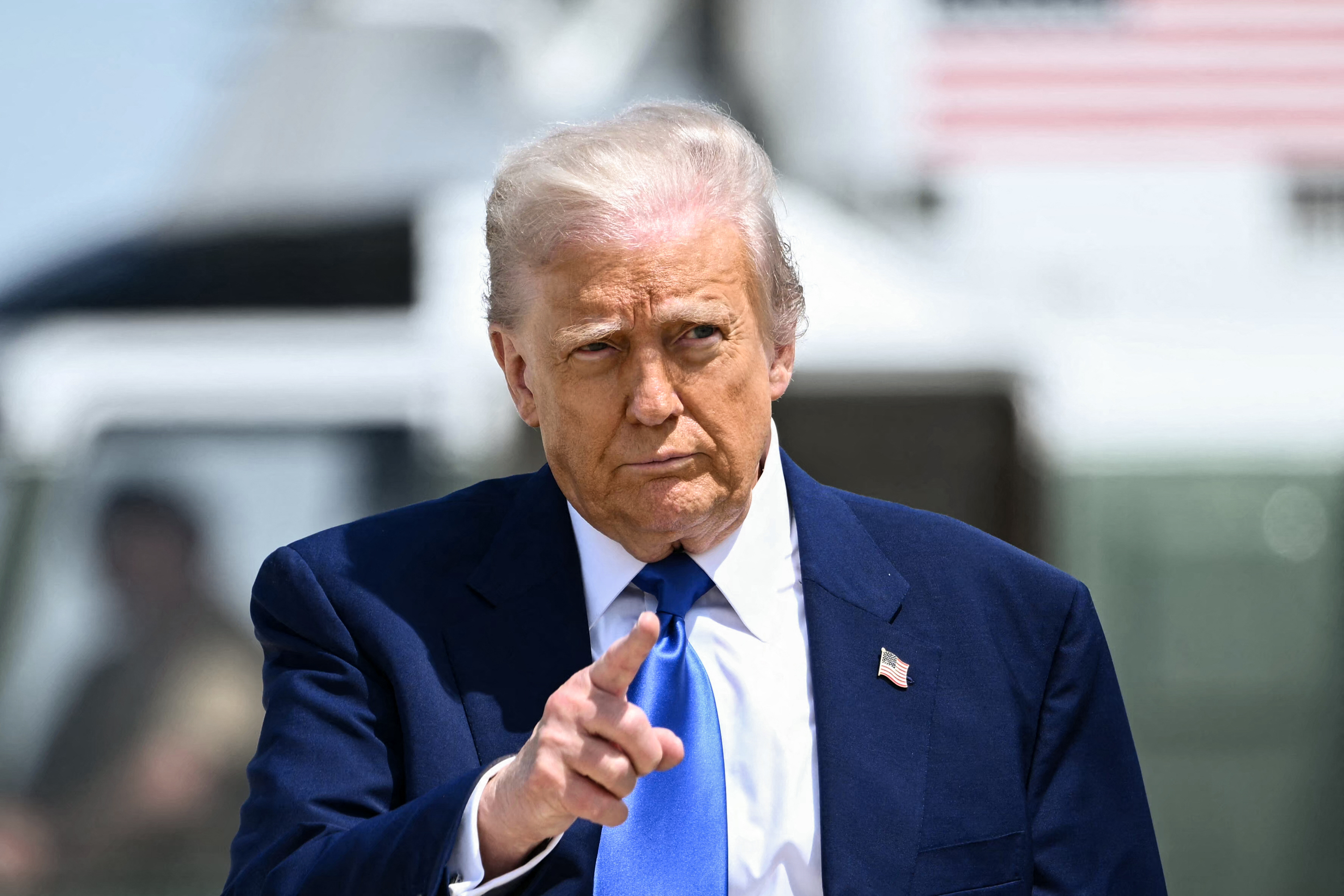 US President Donald Trump gestures as he walks to board Air Force One in Maryland on May 12, 2025 | Source: Getty Images