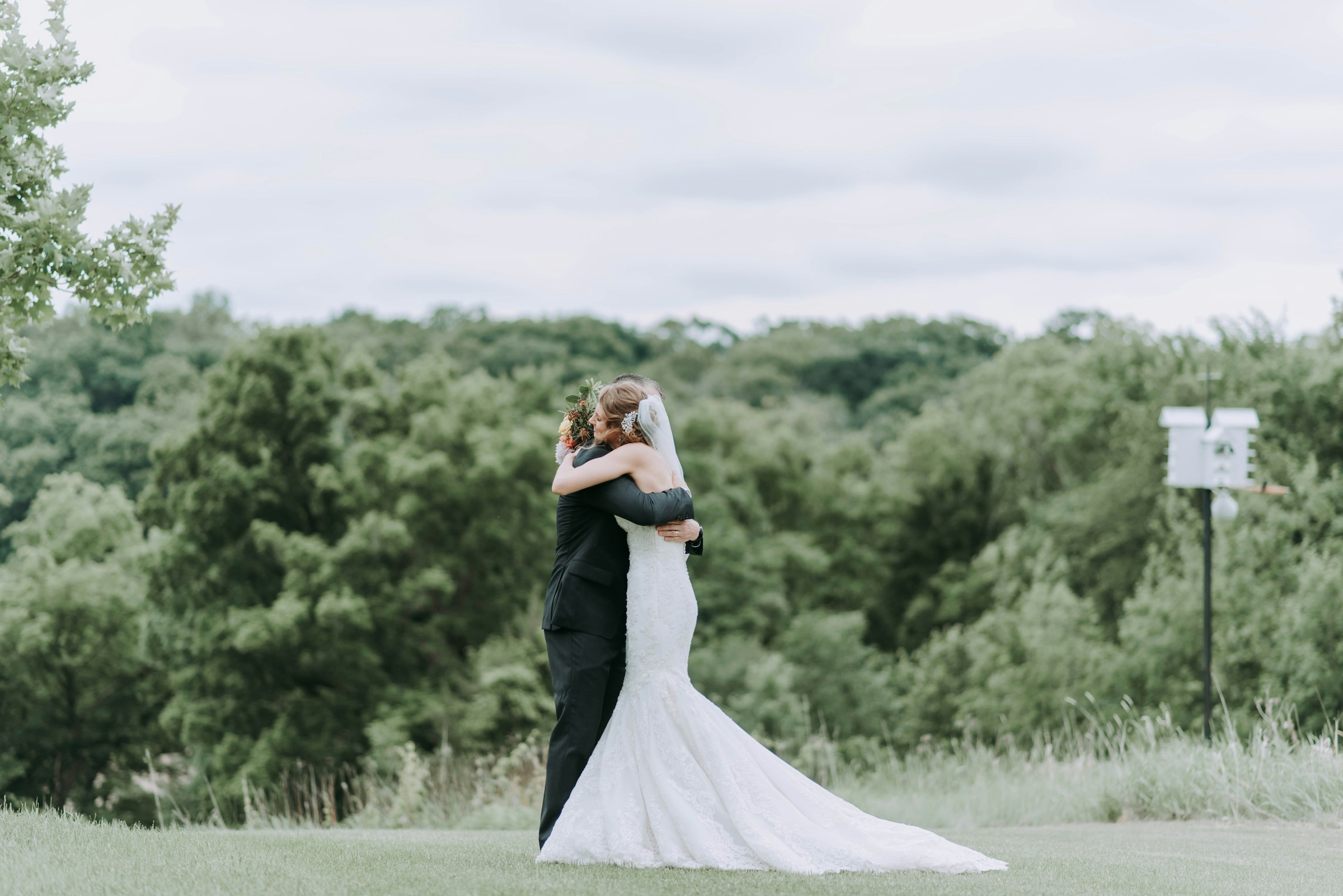 Bride and groom hugging each other | Source: Unsplash