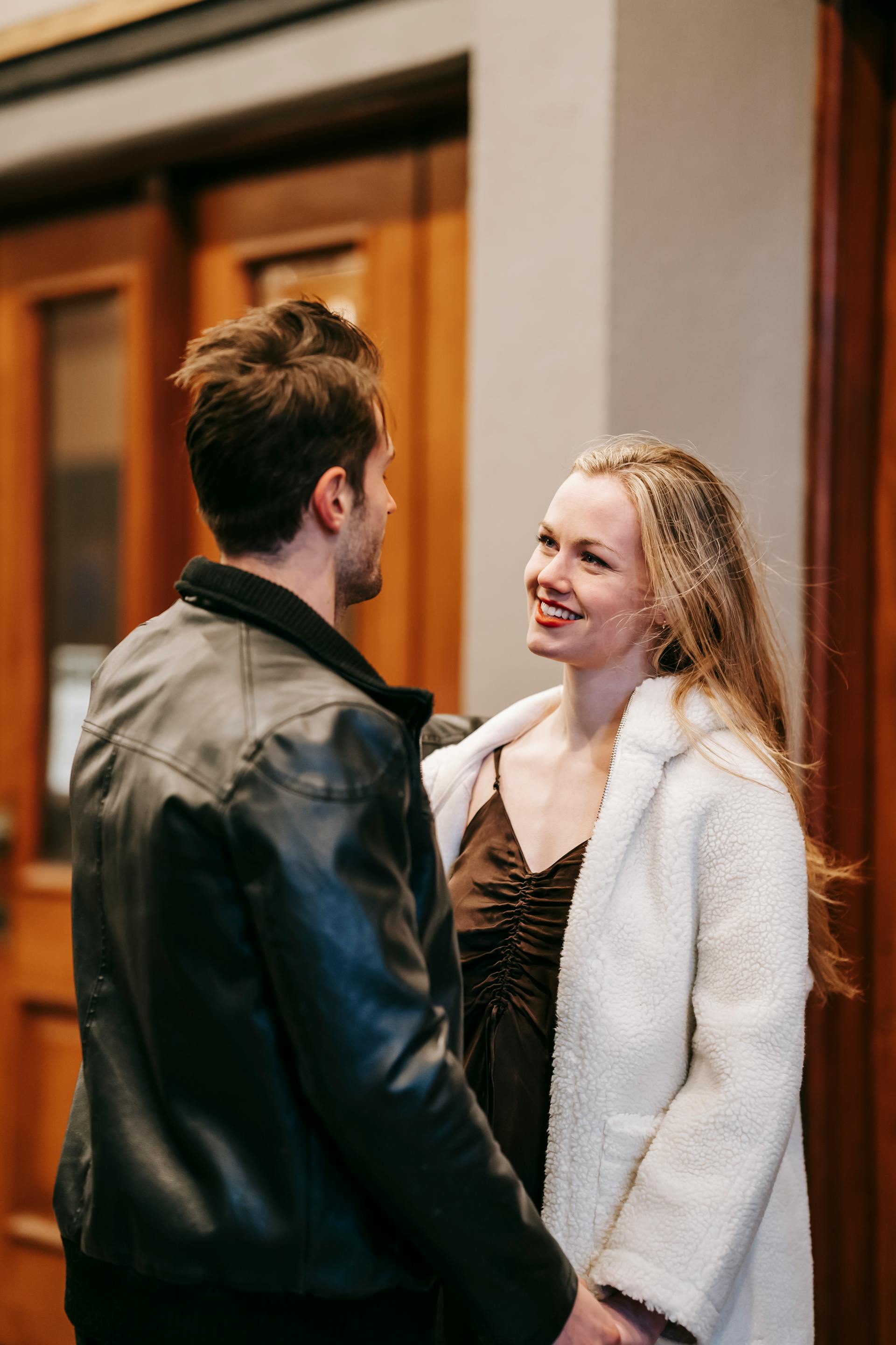 A woman smiles at her fiancé outside a restaurant | Source: Pexels