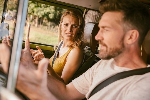 A couple pictured arguing in van on a road trip | Photo: Getty Images