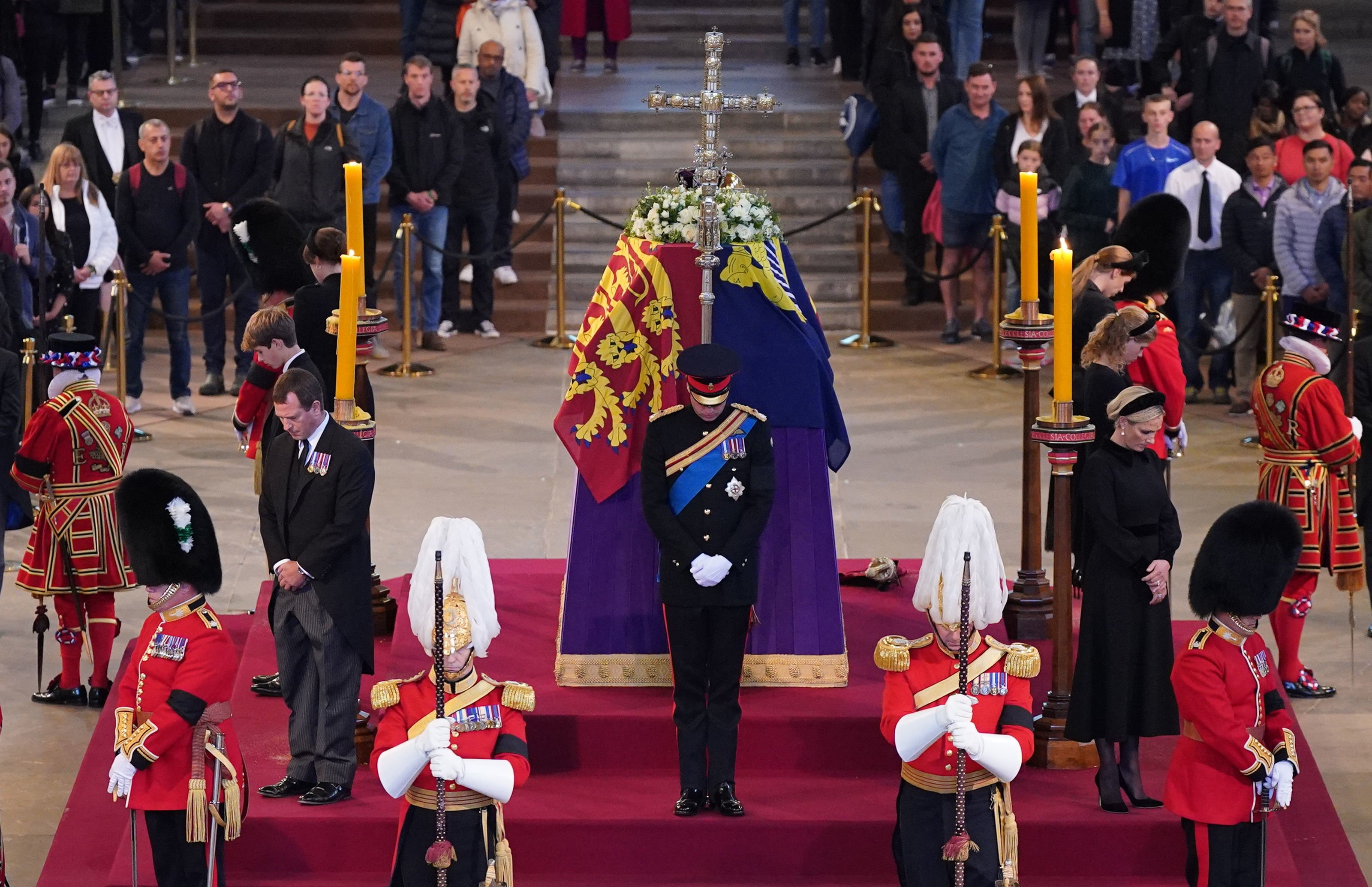 Prince William, Prince Harry, Duke of Sussex, (obscured) Princess Eugenie, Princess Beatrice, Peter Phillips, Zara Tindall, Lady Louise Windsor, James, Viscount Severn hold a vigil in honor of Queen Elizabeth II at Westminster Hall on September 17, 2022 in London, England | Source: Getty Images