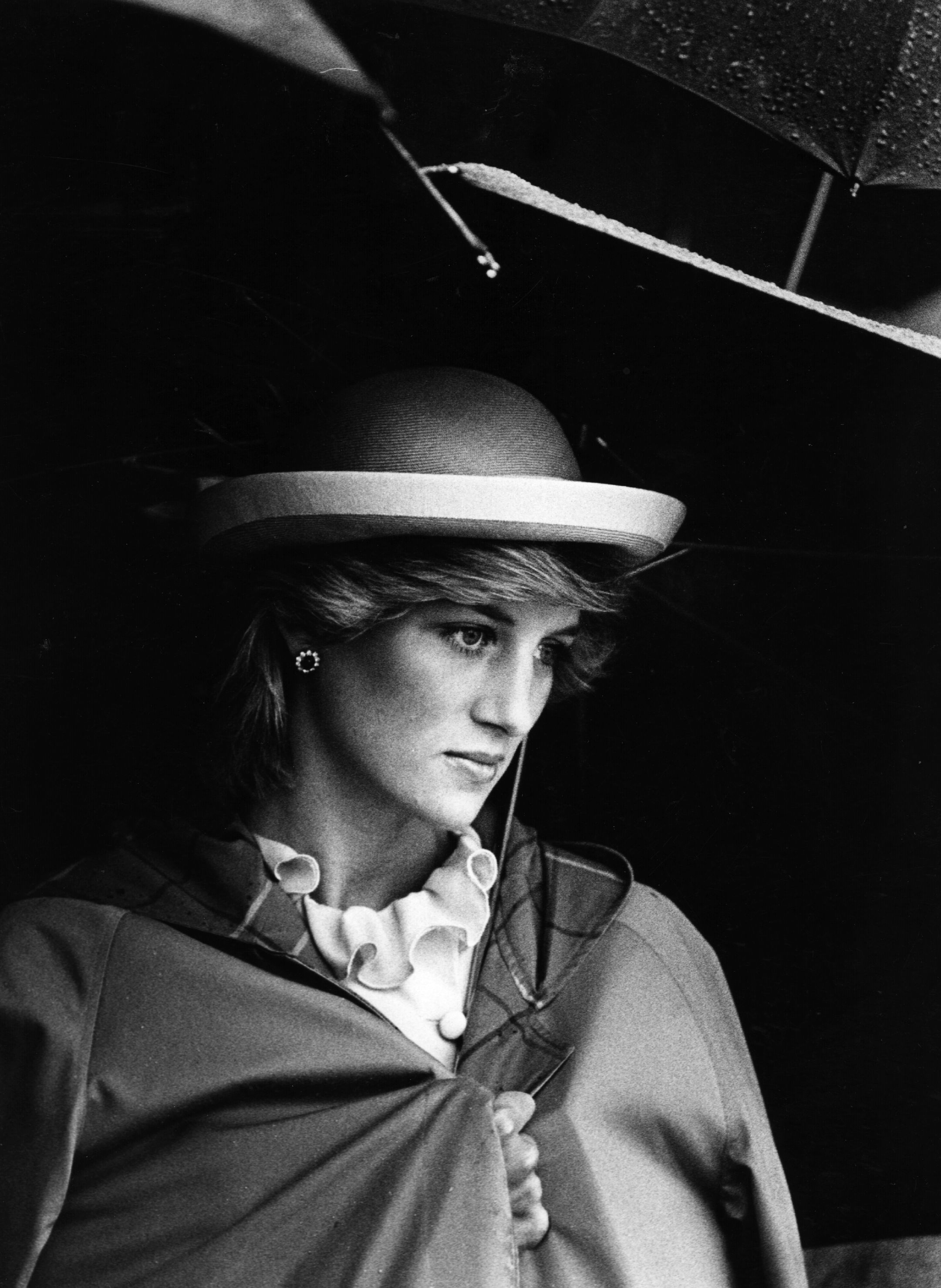 Princess Diana pictured under an umbrella. 1983. | Photo: Getty Images
