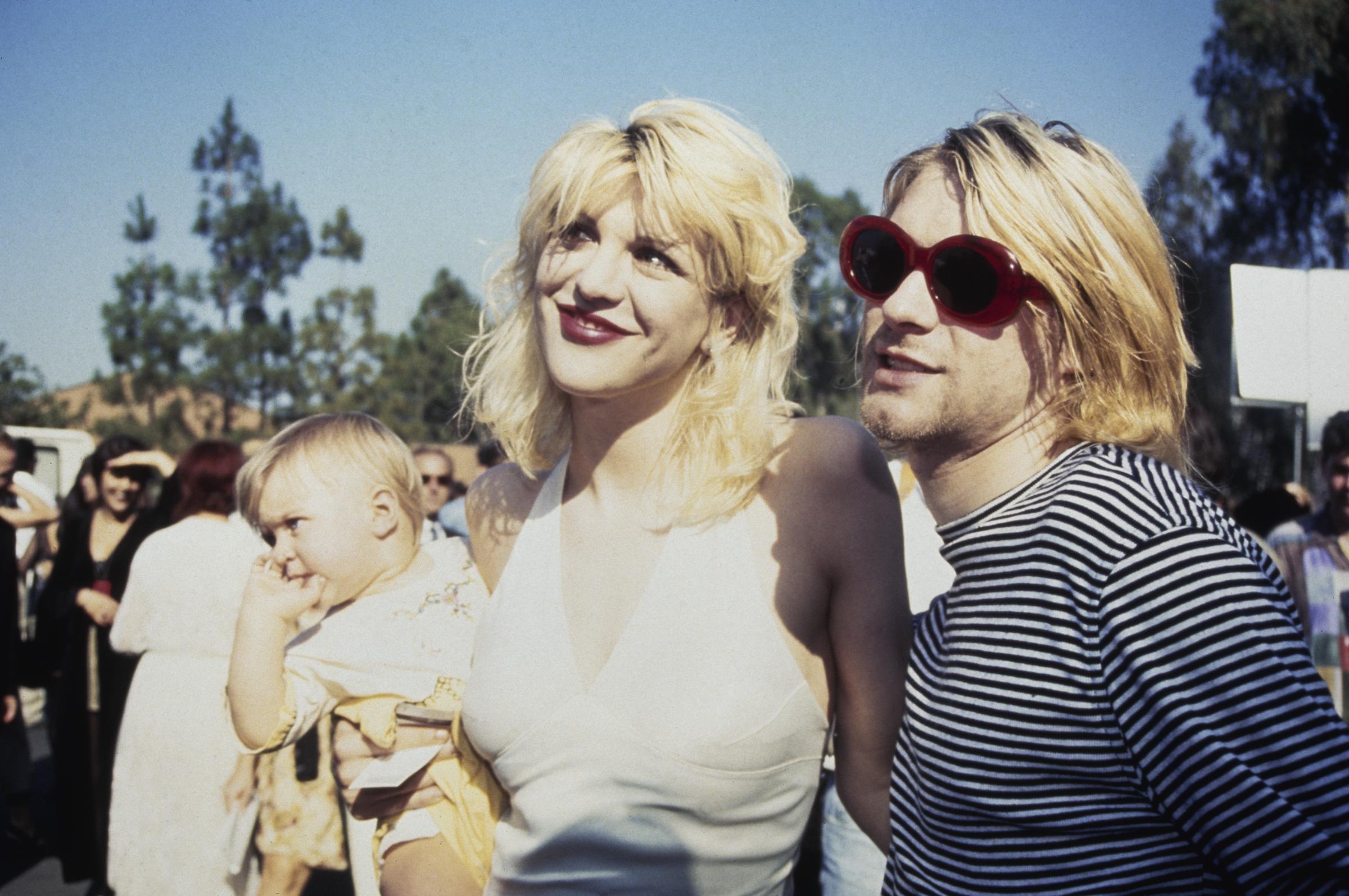 Kurt Cobain, Courtney Love, and their daughter Frances Bean Cobain attend the 10th Annual MTV Video Music Awards, held at the Universal Amphitheater in Universal City, California, on September 2, 1993. | Source: Getty Images