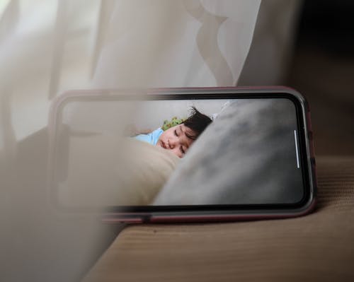 Nanny cam connected to a cell phone | Source:  Pexels