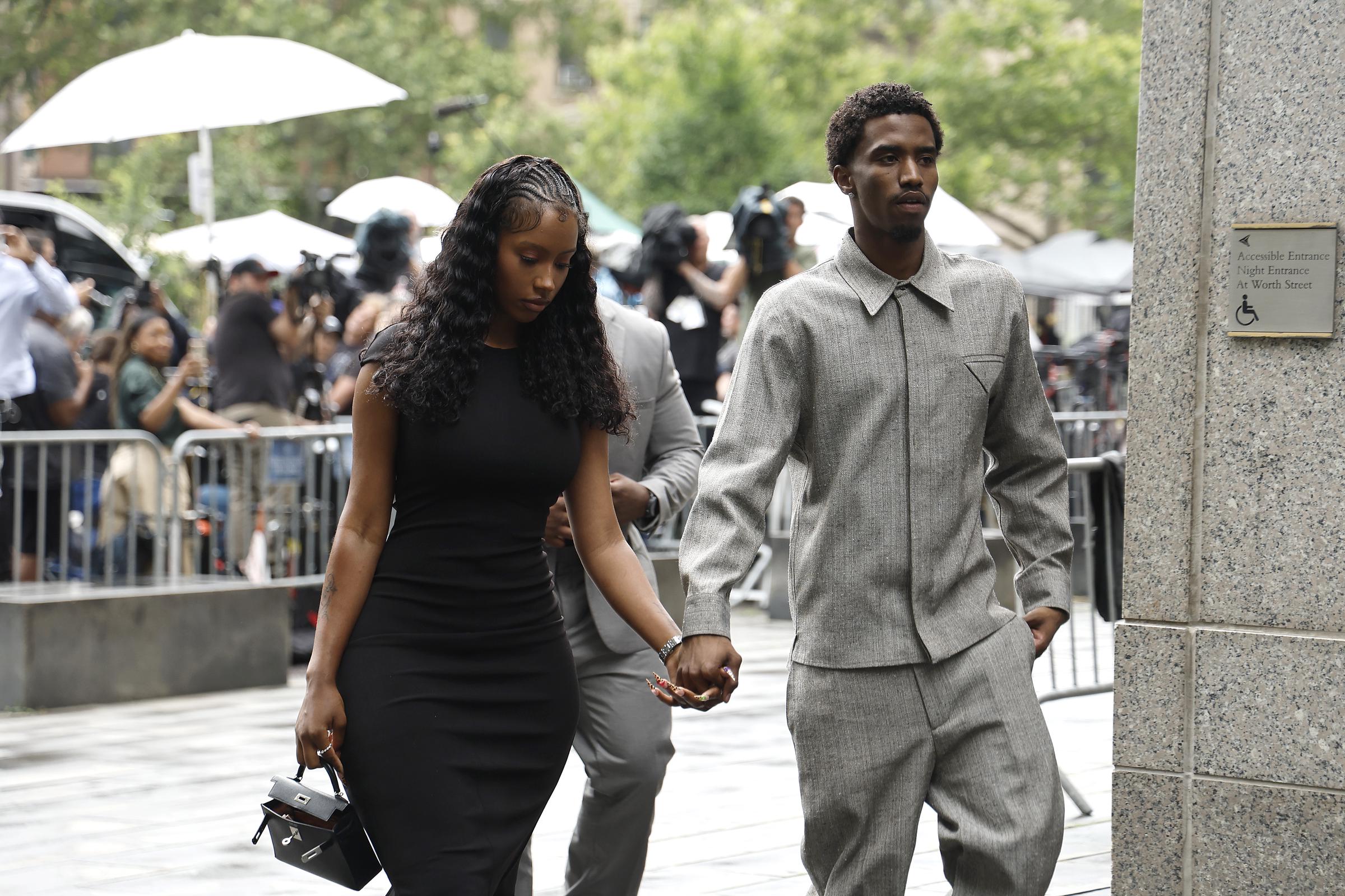 King Combs arrives at court on July 2, holding hands with Raven Tracy. Both wear serious expressions as they approach the courthouse, avoiding eye contact with the cameras.