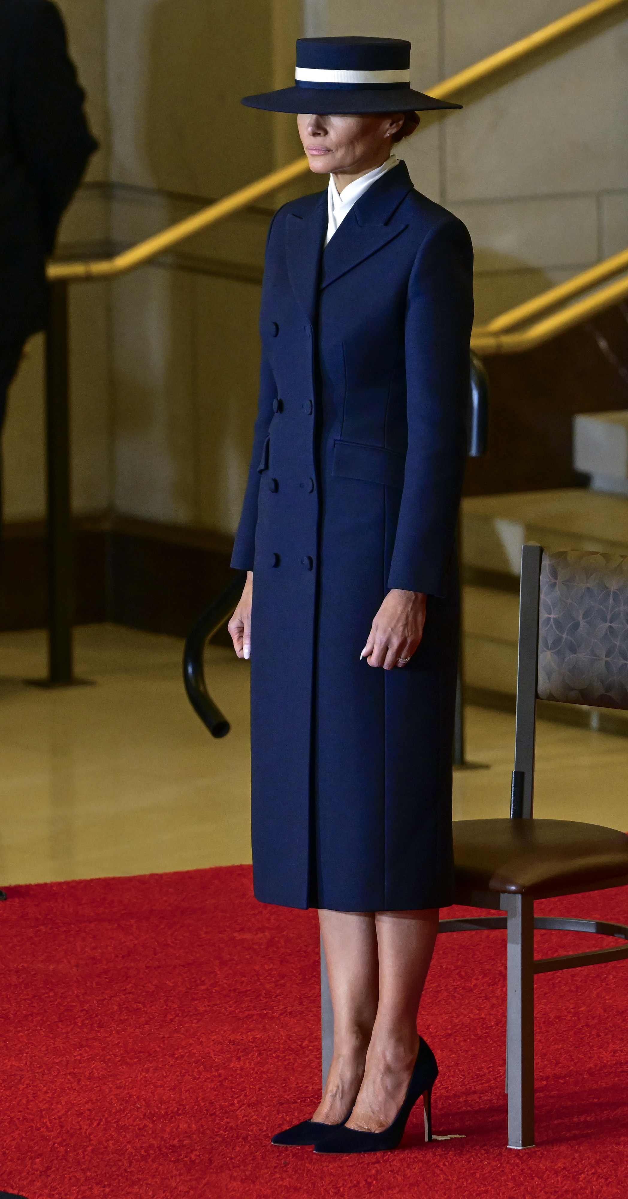 Melania Trump looks on as Donald Trump participates in a Reviewing the Troops Ceremony | Source: Getty Images