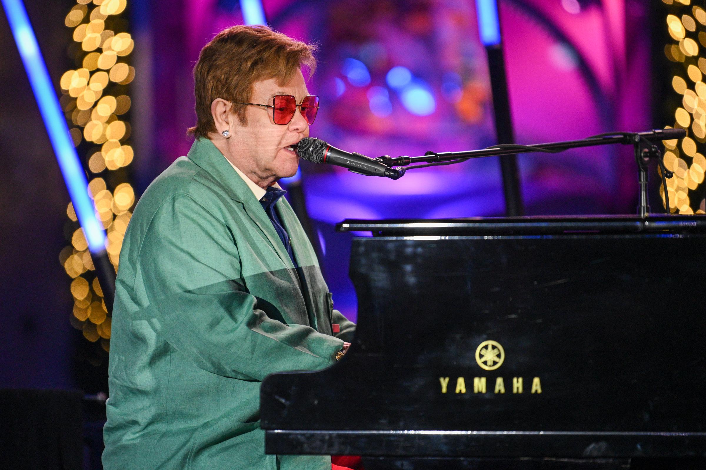 Elton John performs in the opening ceremony for Saks Fifth Avenue’s Holiday Windows and Light show in New York City, on November 22, 2022 | Source: Getty Images