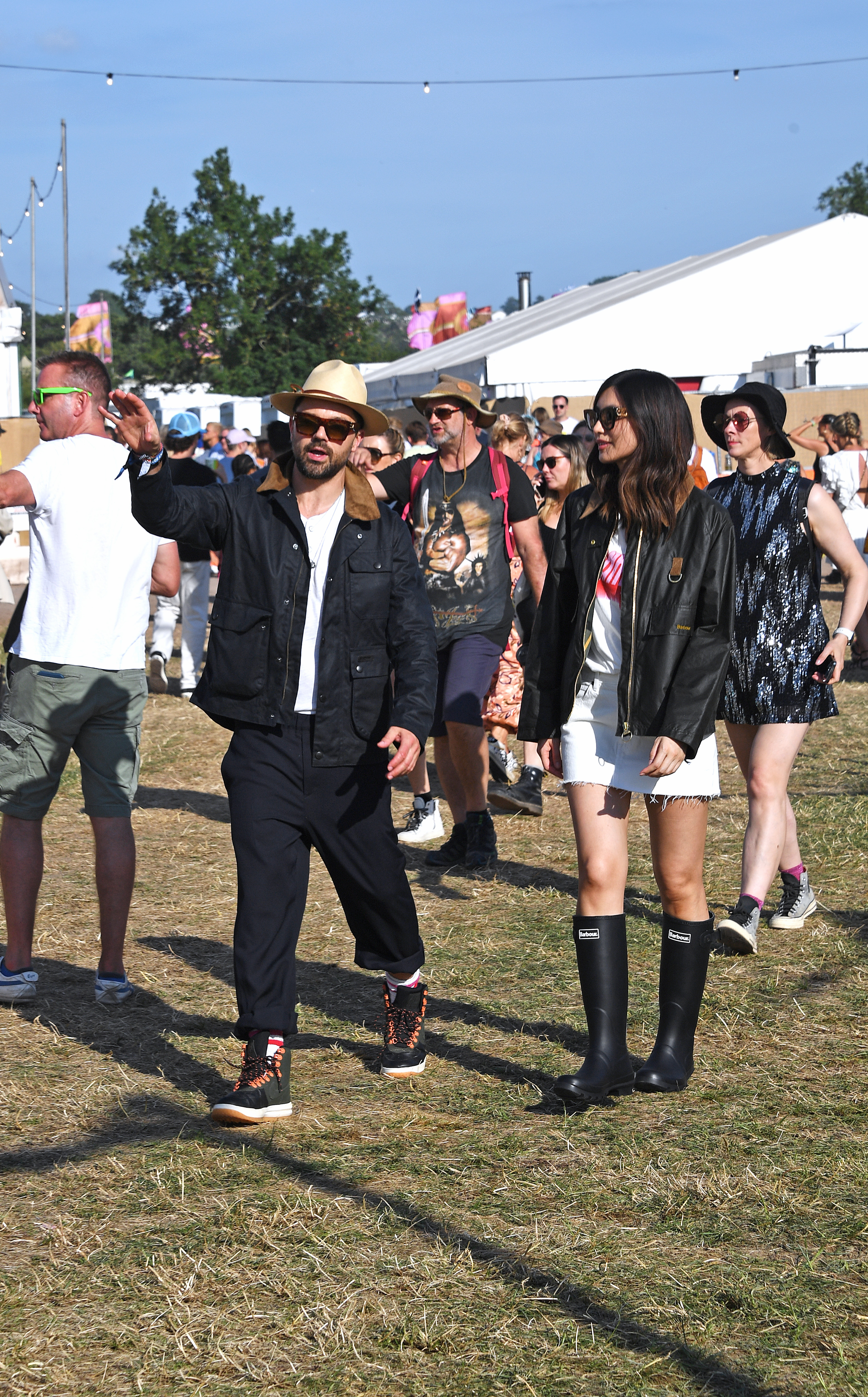 Dominic Cooper and Gemma Chan are seen on day one of the Glastonbury Festival wearing their Barbour wax jackets on June 23, 2023, in Glastonbury, England. | Source: Getty Images