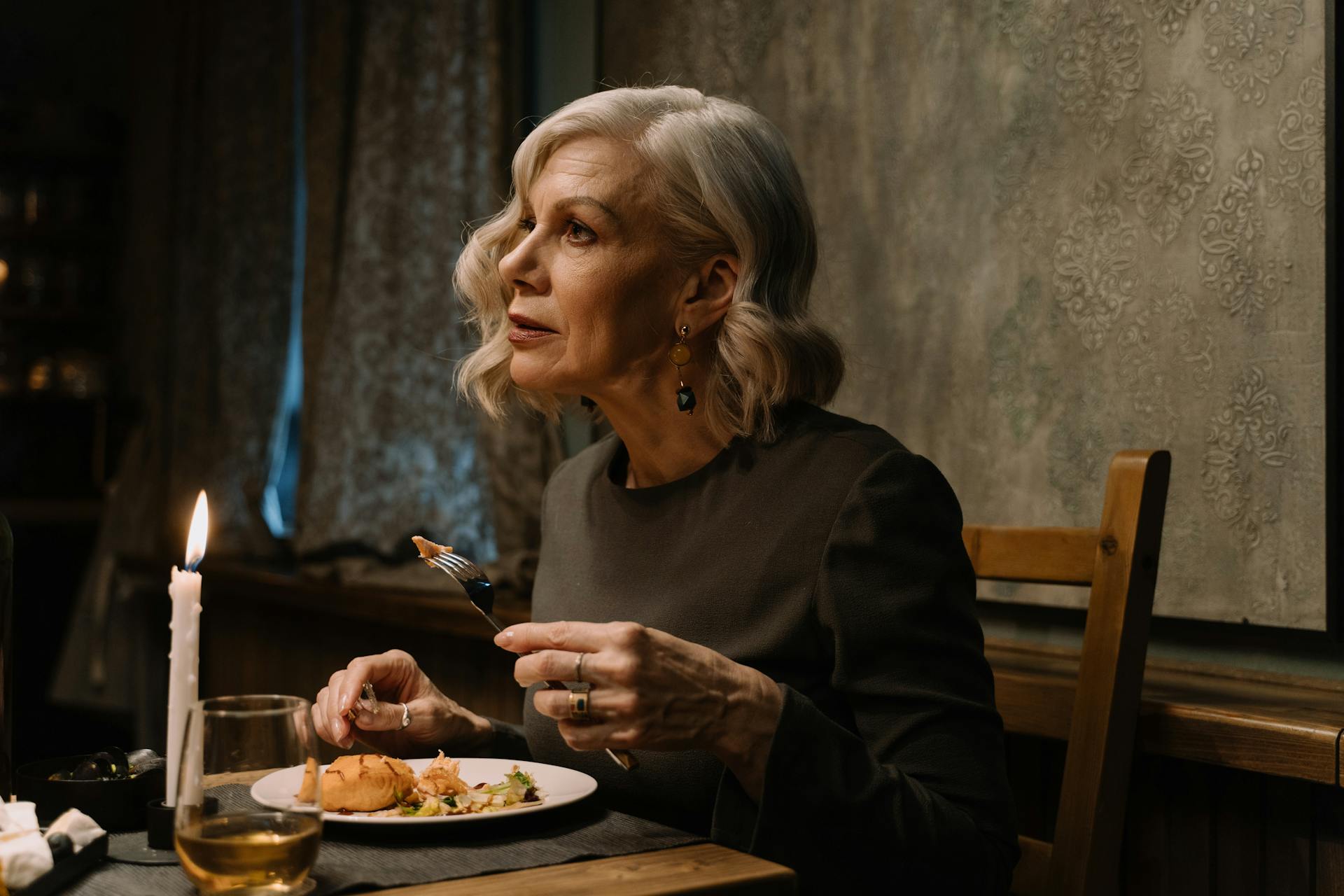 A senior woman having dinner | Source: Pexels