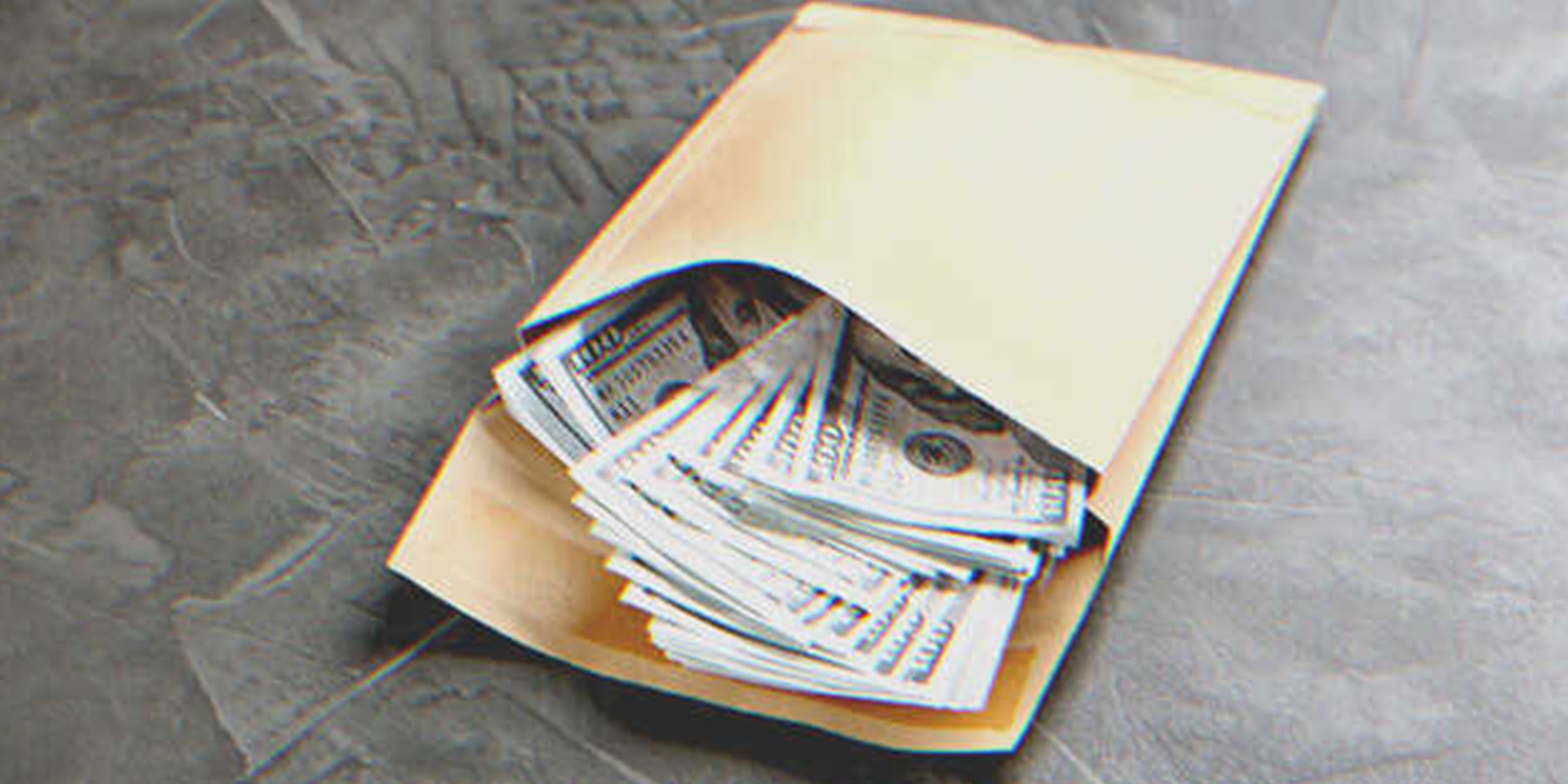 An envelope full of money | Source: Shutterstock
