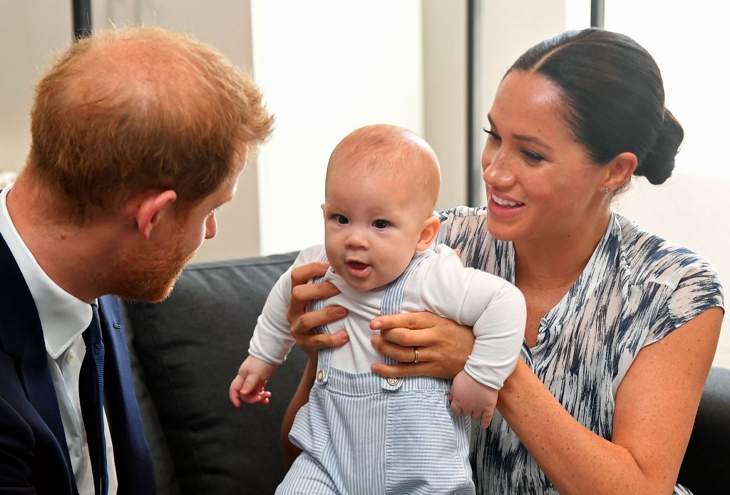 Prince Harry, Duke of Sussex and Meghan, Duchess of Sussex tend to their baby son Archie Mountbatten-Windsor at a meeting with Archbishop Desmond Tutu at the Desmond & Leah Tutu Legacy Foundation during their royal tour of South Africa on September 25, 2019 | Photo: Getty Images