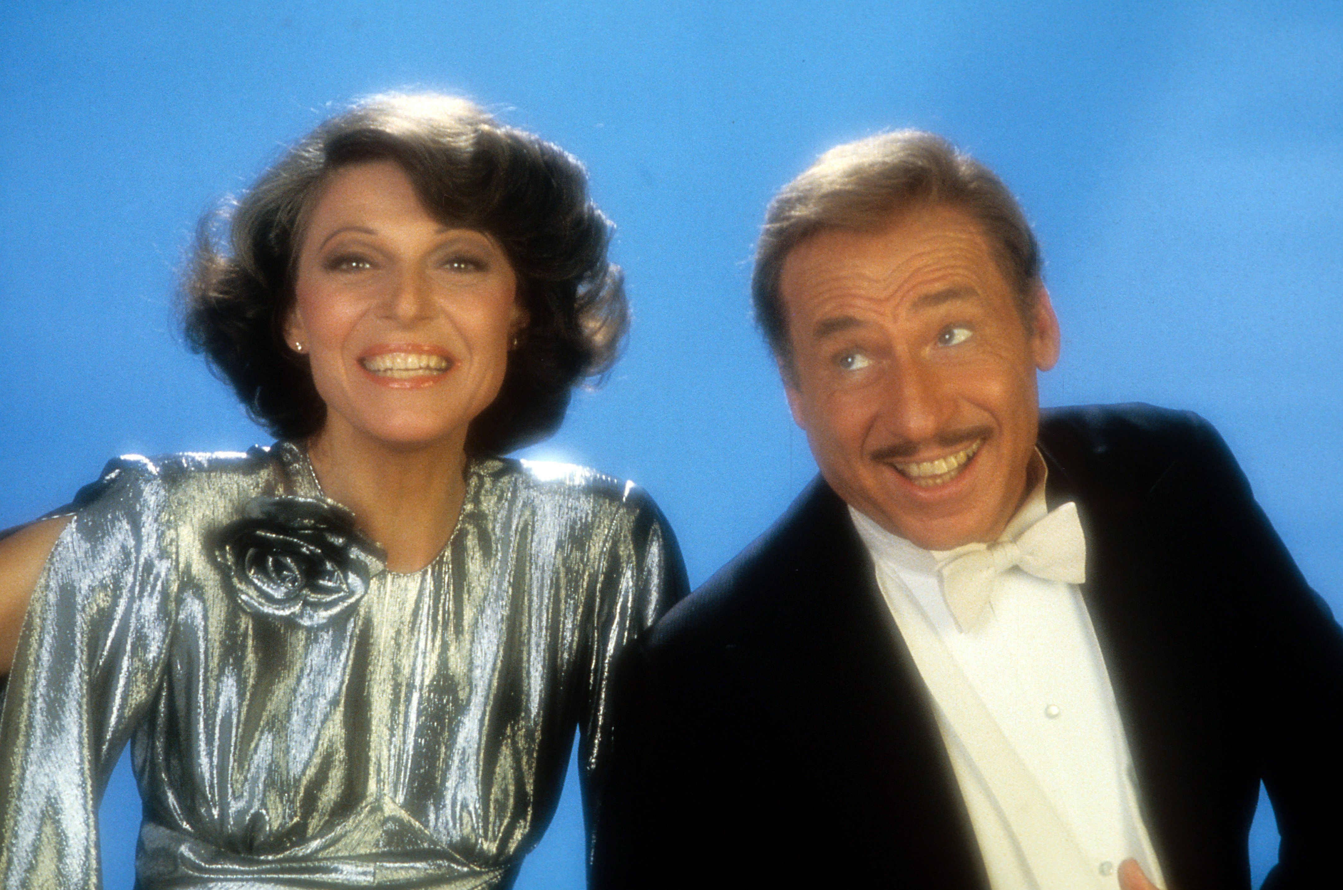 Anne Bancroft and Mel Brooks smile for a publicity photo in 1983. | Source: Getty Images