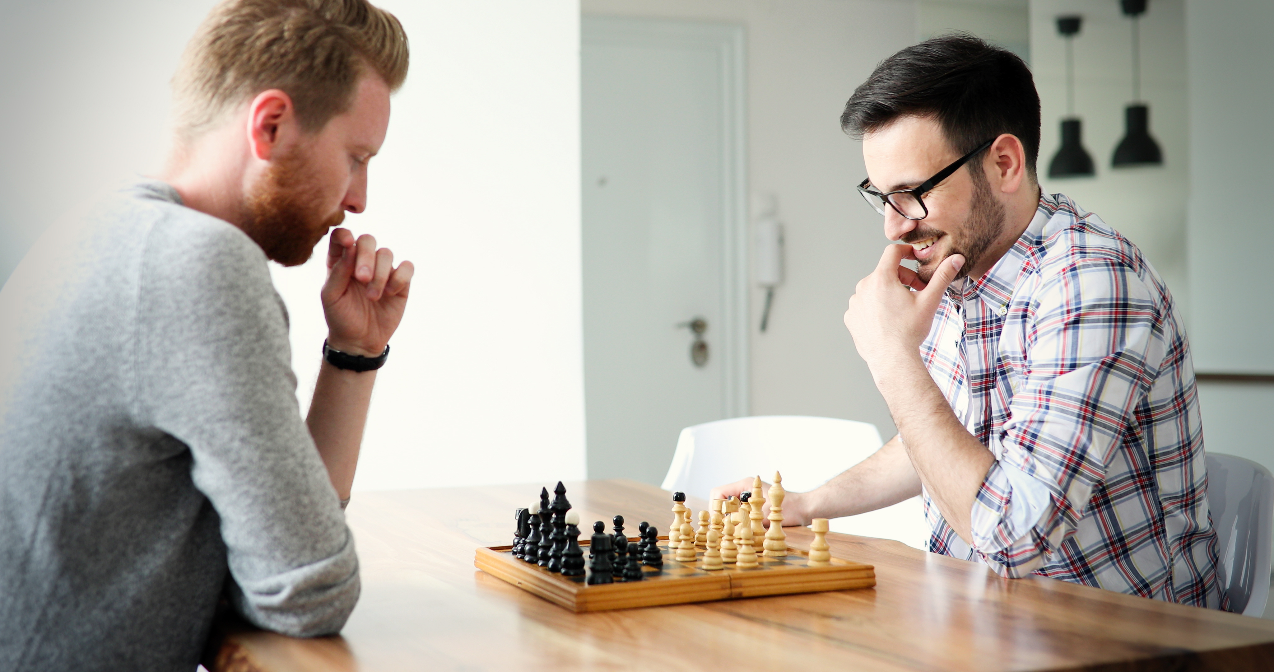 Men playing chess. | Source: Shutterstock