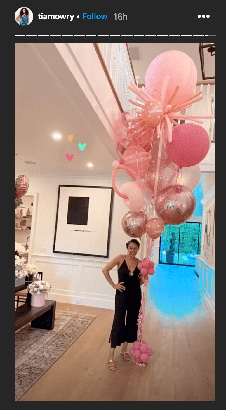 Tia Mowry posed with an assortment of pink balloons in her home | Source: Instagram.com/tiamory