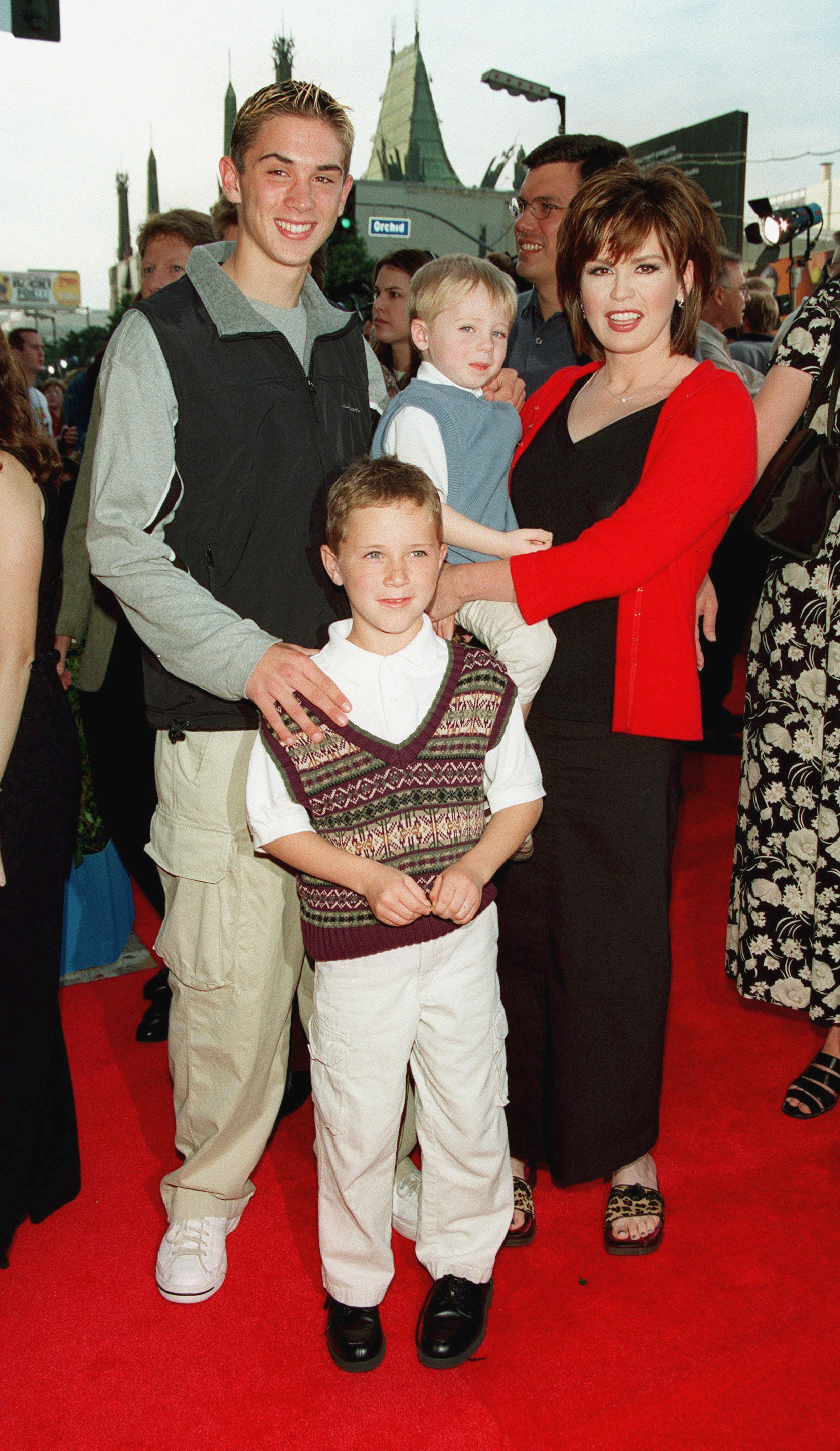 Marie Osmond with her sons Stephen [Far Left], Michael [standing] and Brandon at the World Premiere of "Toy Story 2" in Los Angeles | Source: Getty Images