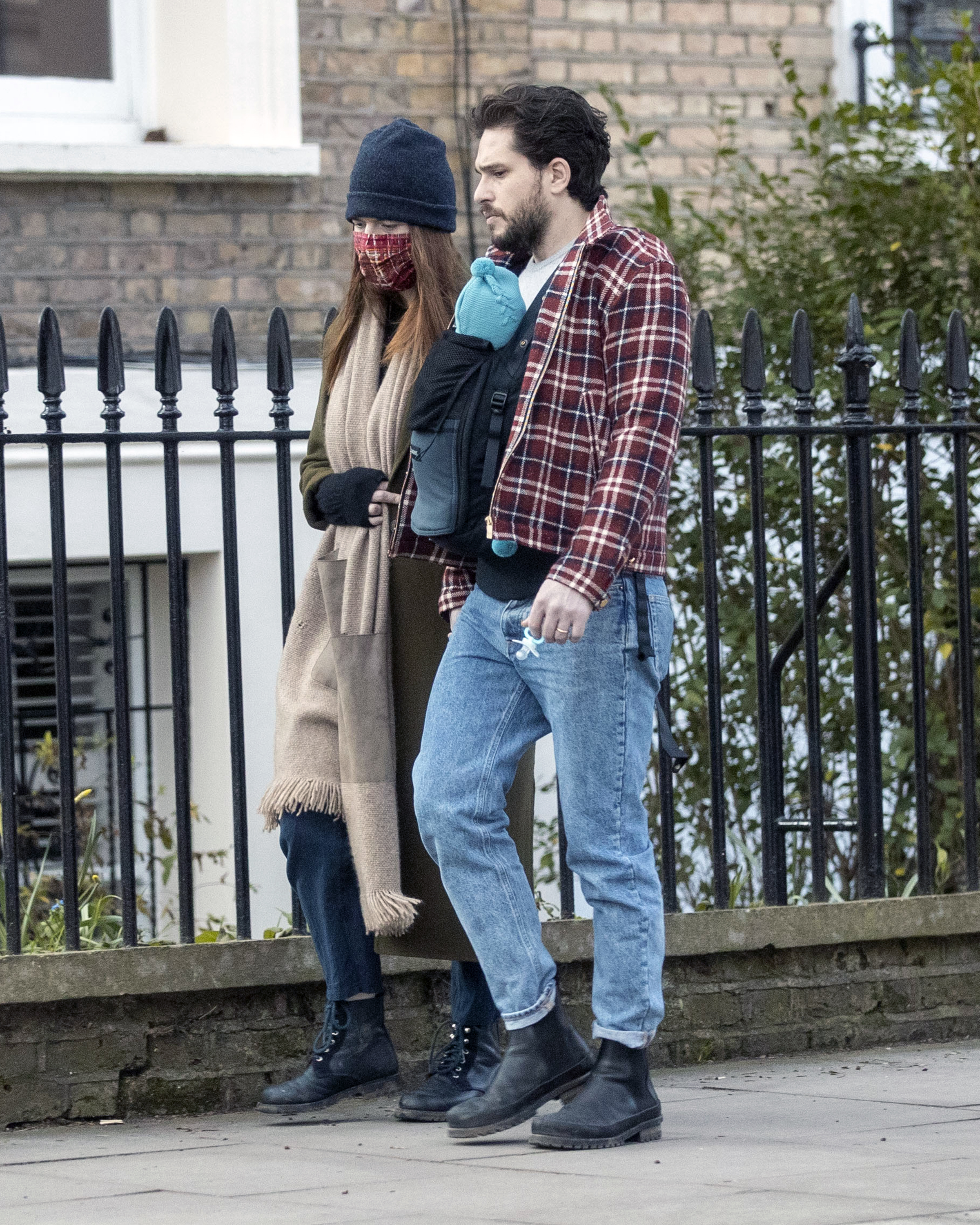Rose Leslie and Kit Harington seen on a walk with their baby on February 24, 2021, in London, England. | Source: Getty Images