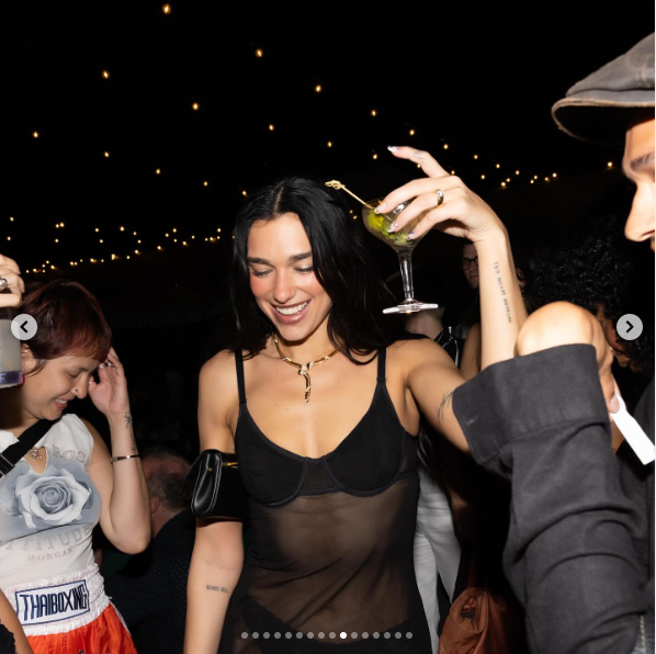 Dua Lipa in a see-through dress, celebrating following her performance at Wembley Stadium posted on June 22, 2025 | Source: Instagram/dualipa