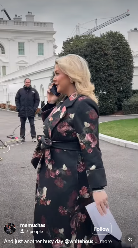 Karoline Leavitt continues her call near the press area as staff and equipment are visible in the background | Source: Instagram/memuchas