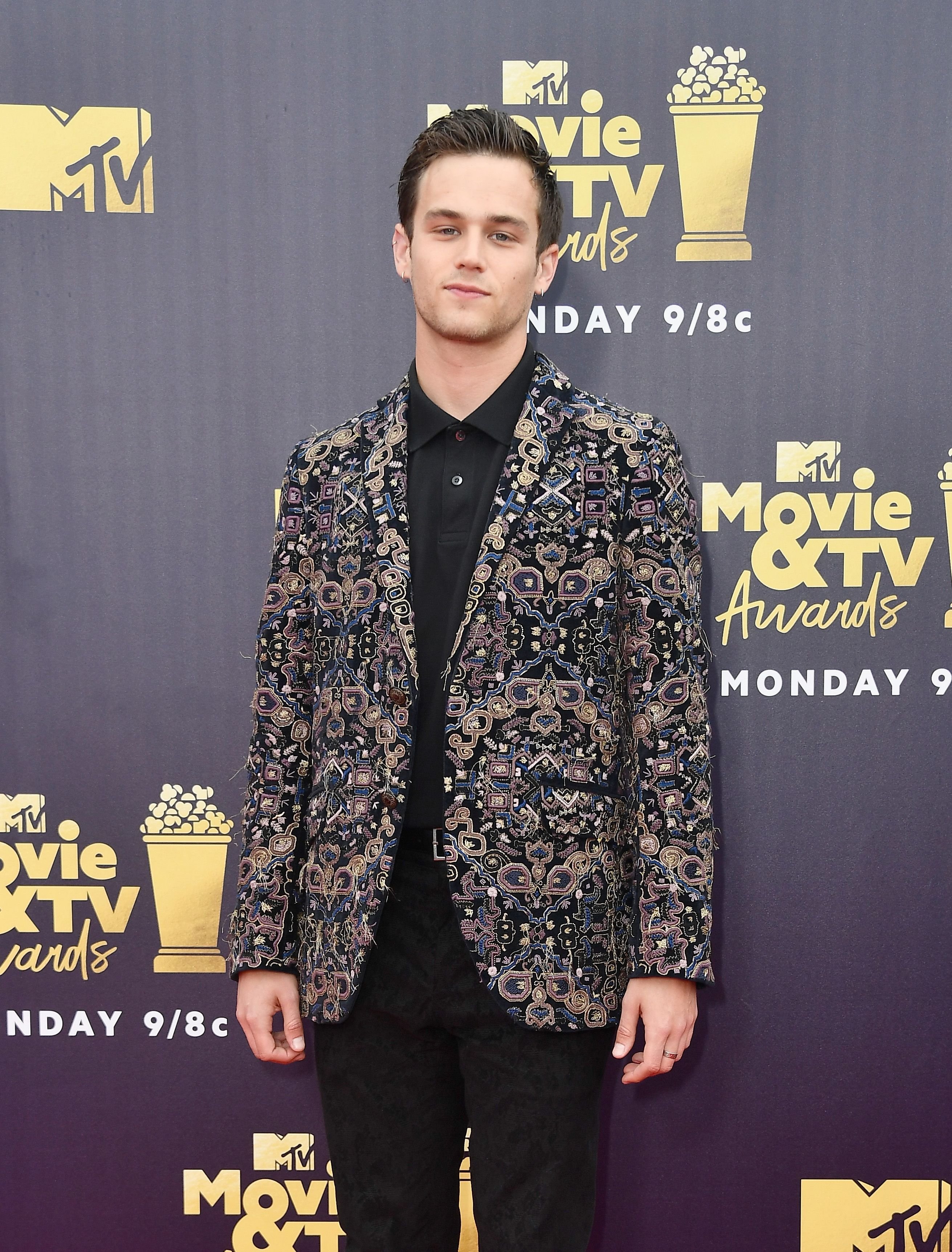 Brandon Flynn during the 2018 MTV Movie And TV Awards at Barker Hangar on June 16, 2018, in Santa Monica, California. | Source: Getty Images