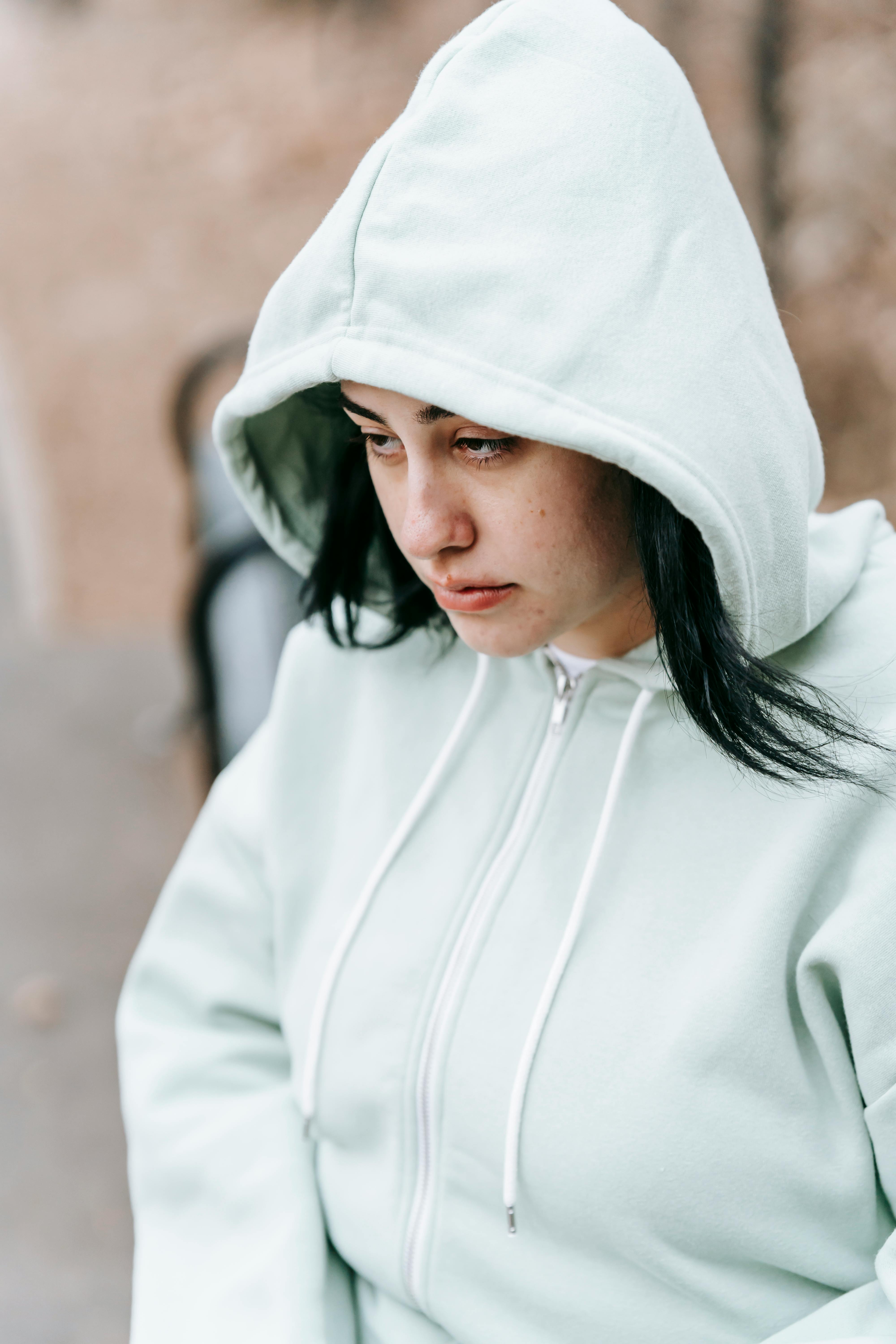 A sad woman in a hoodie | Source: Pexels